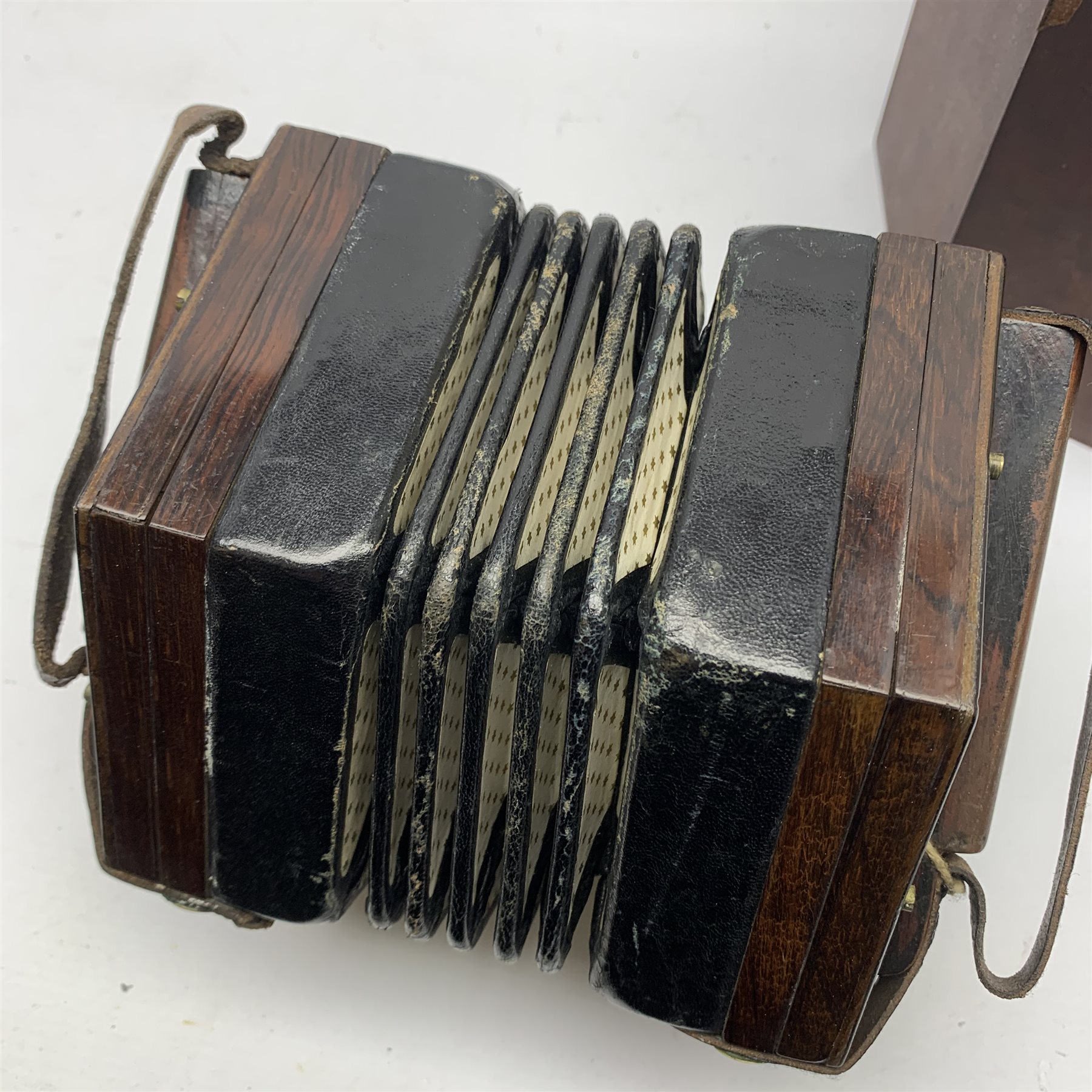 19th century rosewood concertina of hexagonal form with fretworked ends ...