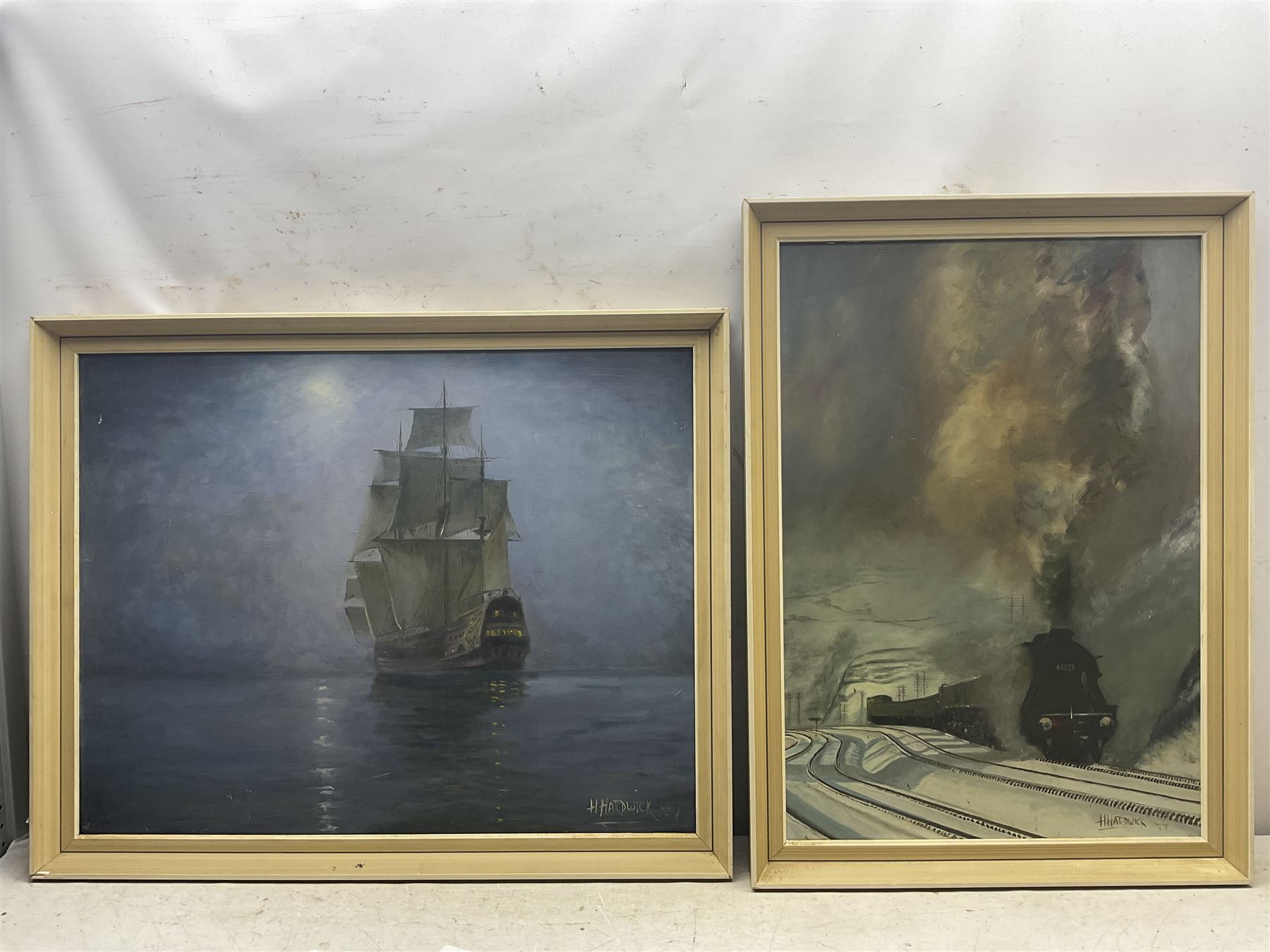 H Hardwick (British 20th Century): Steam Train and Ship, two oils on board signed and dated '77, max 59cm x 75cm (2)
