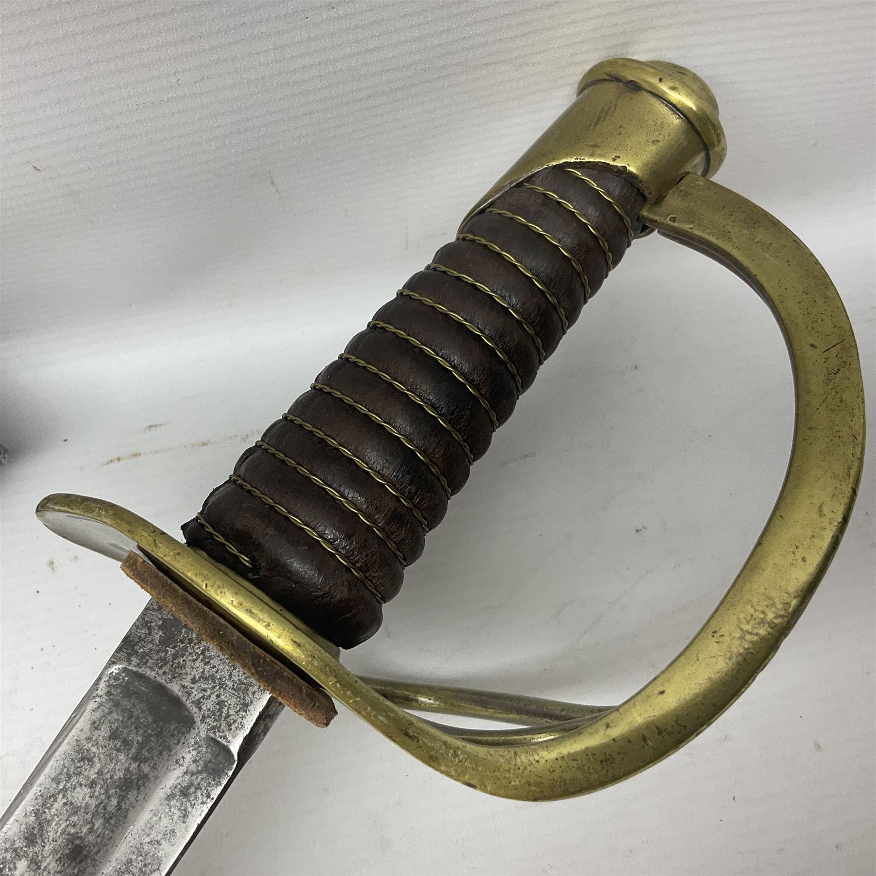 19th century French 1822 Pattern Light Cavalry trooper's sword with 88.5cm slightly curving fullered blade, brass three-bar hilt and wire-bound leather grip; in polished steel scabbard with two suspension rings L110.5cm overall