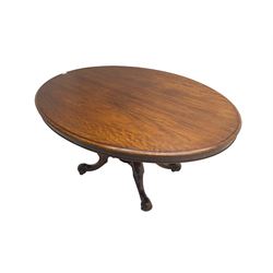 Victorian mahogany oval loo table, moulded edge with banded frieze, raised on baluster turned pedestal with quadrupod base, cabriole supports with scroll feet and castors