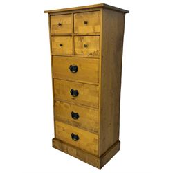 Laura Ashley - contemporary oak tall chest of drawers from the Garrat range, honeycomb rectangular top featuring central groove, over four small drawers with brass knob pulls and four long drawers with drop handles, on plinth base