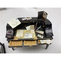 Collection of miniature dolls house furniture, to include five drawer chest painted with blossom, cream and gilt double door mirrored wardrobe, four piece lacquered style desk set, three piece suite, writing desk, wash stand, Knoll style sofa etc (14)