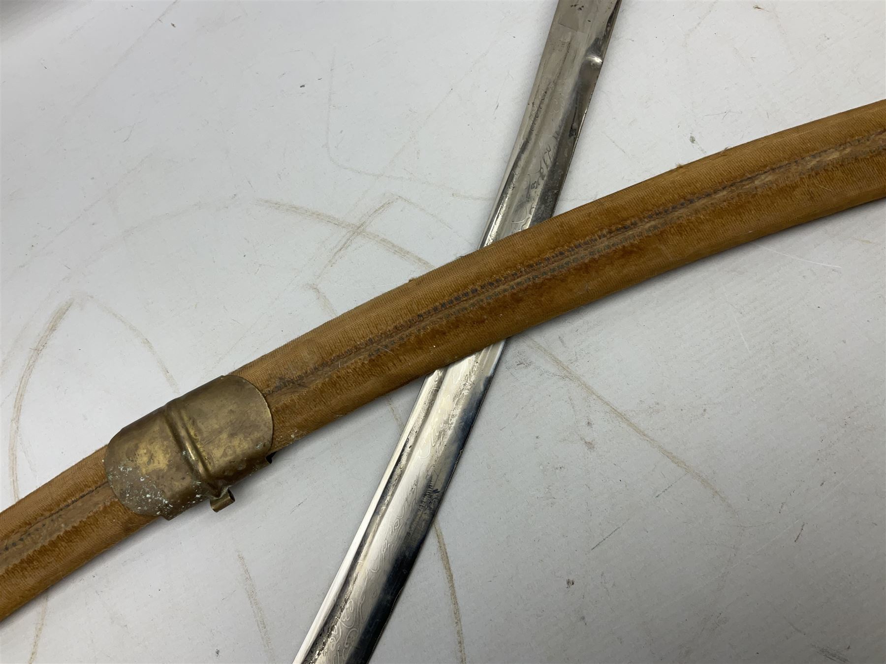 Early 20th century Indian ebonised sword stick, the 59.5cm blade with punched decoration and horn grip L94cm overall; and a reproduction Indian tulwar with scabbard (2)