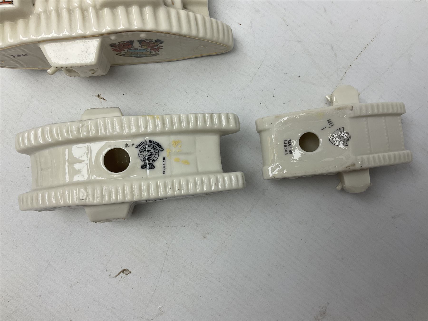 Twelve crested china models of WW1 tanks by Grafton, Arcadian and Carlton china etc with crests from Caistor Lincs, Saffron Walden, Paignton, Evesham etc  , together with a crested china model of the R.M.S Lusitania with New Brighton crest and a two-handled vase for 'The Forts Boxhill' (14)