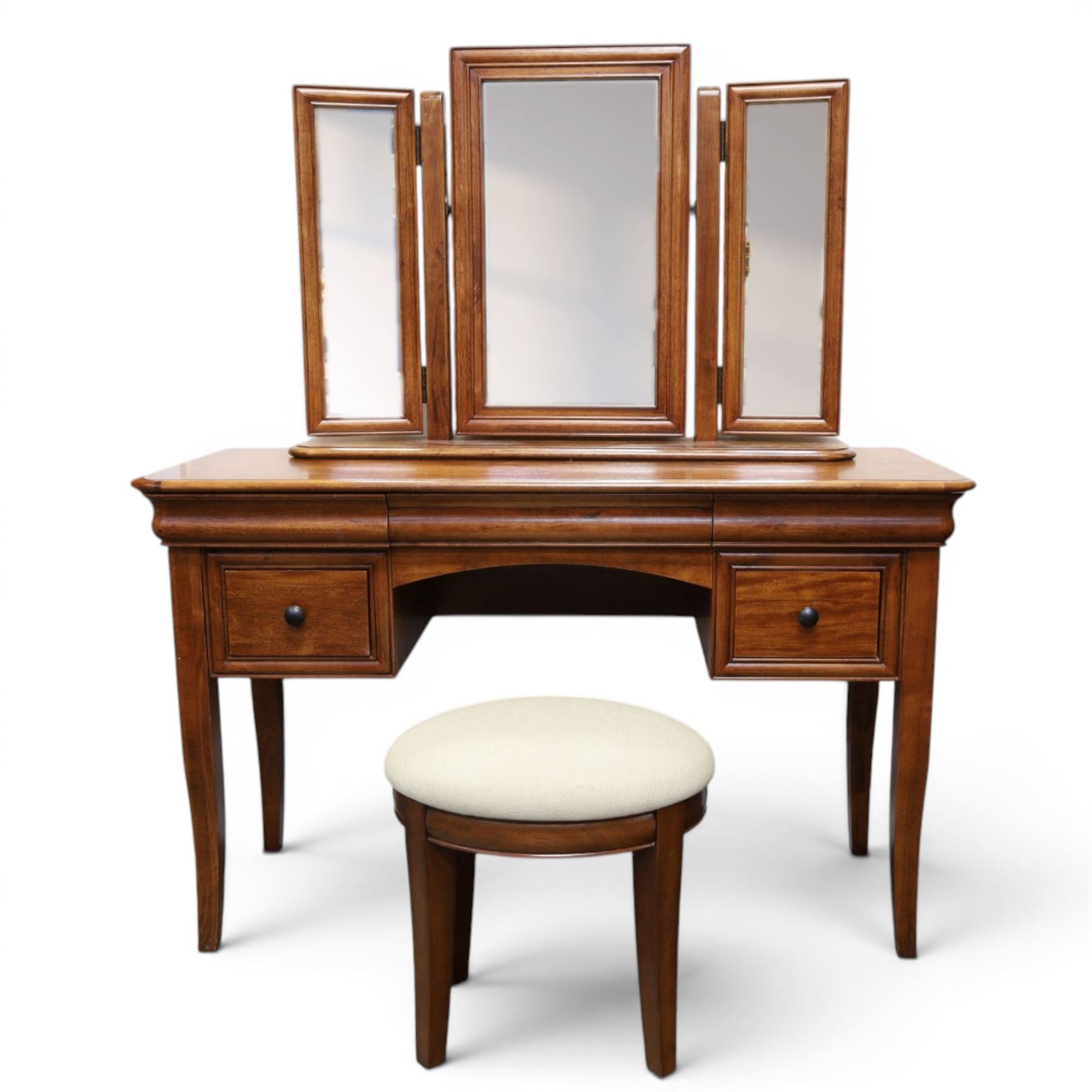 Willis & Gambier - mahogany dressing table, three part mirror and stool, the dressing table with rectangular top with chamfered corners, over two baize lined frieze drawers, kneehole recess and a single drawer either side, three part mirror with central tilting mirror on a moulded plinth base, with oval beige padded stool 