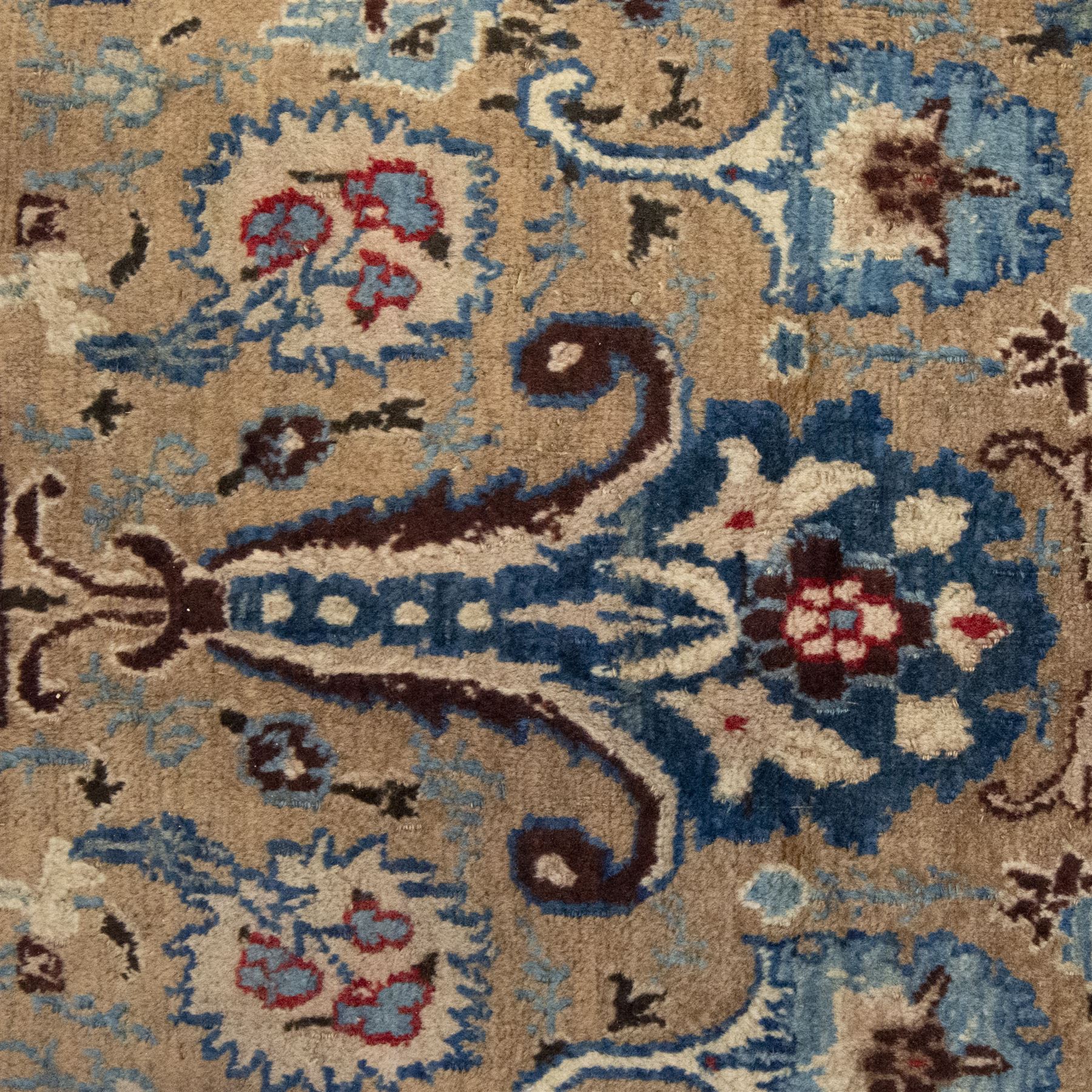 Central-Western Persian Sarouk hand-knotted carpet, beige ground, with an all-over design of boteh and floral sprays in red and blue within a floral border on blue ground 