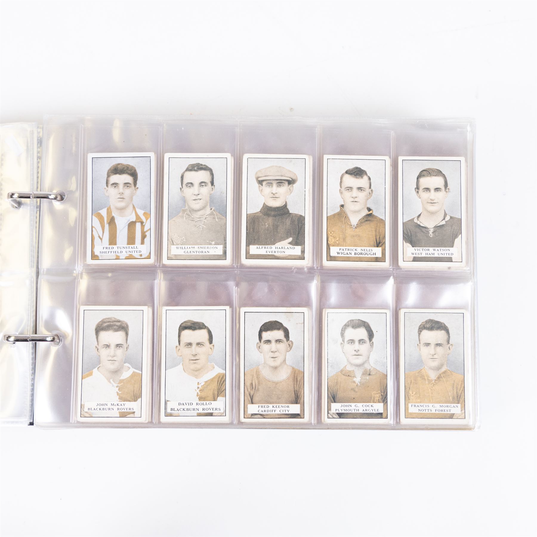 Collection of Edwardian and later Football related trading and cigarette cards, including forty-nine of fifty 1906 Ogden's Football Club Colours, 1922 PALS Footall series, ninety of one hundred 1925 Gallaher Famous Footballers, complete set of forty-four 1926 Ogden's Captains of Association Football Clubs and Colours, complete set of fifty 1927 Players Football Caricatures by MAC,  complete set of fifty 1927 Players Football Caricatures by RIP,  complete set of fifty 1930 Players Association Cup Winners, complete set of 50 1933 Ogdens AFC Nicknames etc, housed in brown cigarette card album