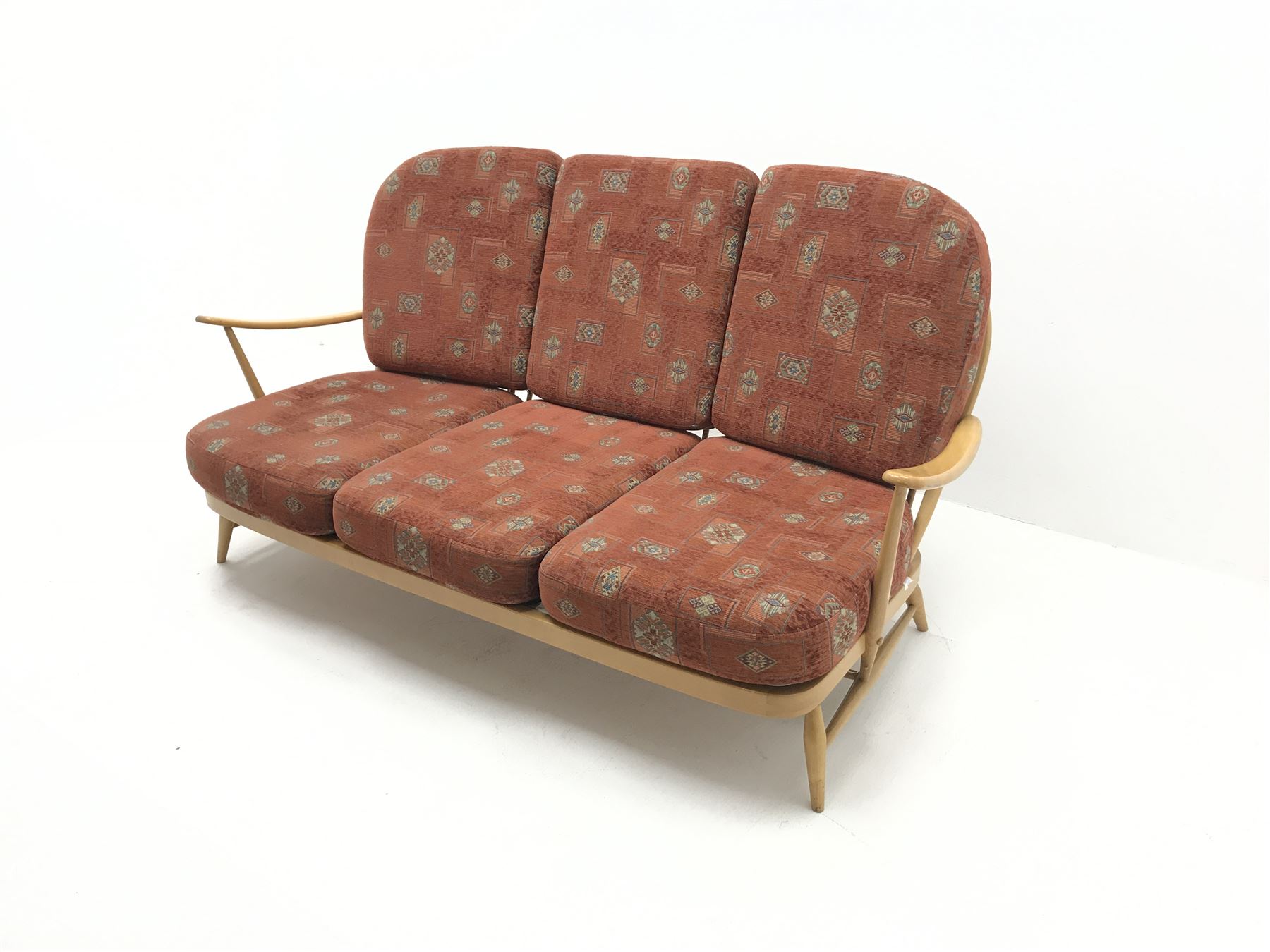 Ercol three seat Windsor sofa with loose cushions, spindle back, turned supports