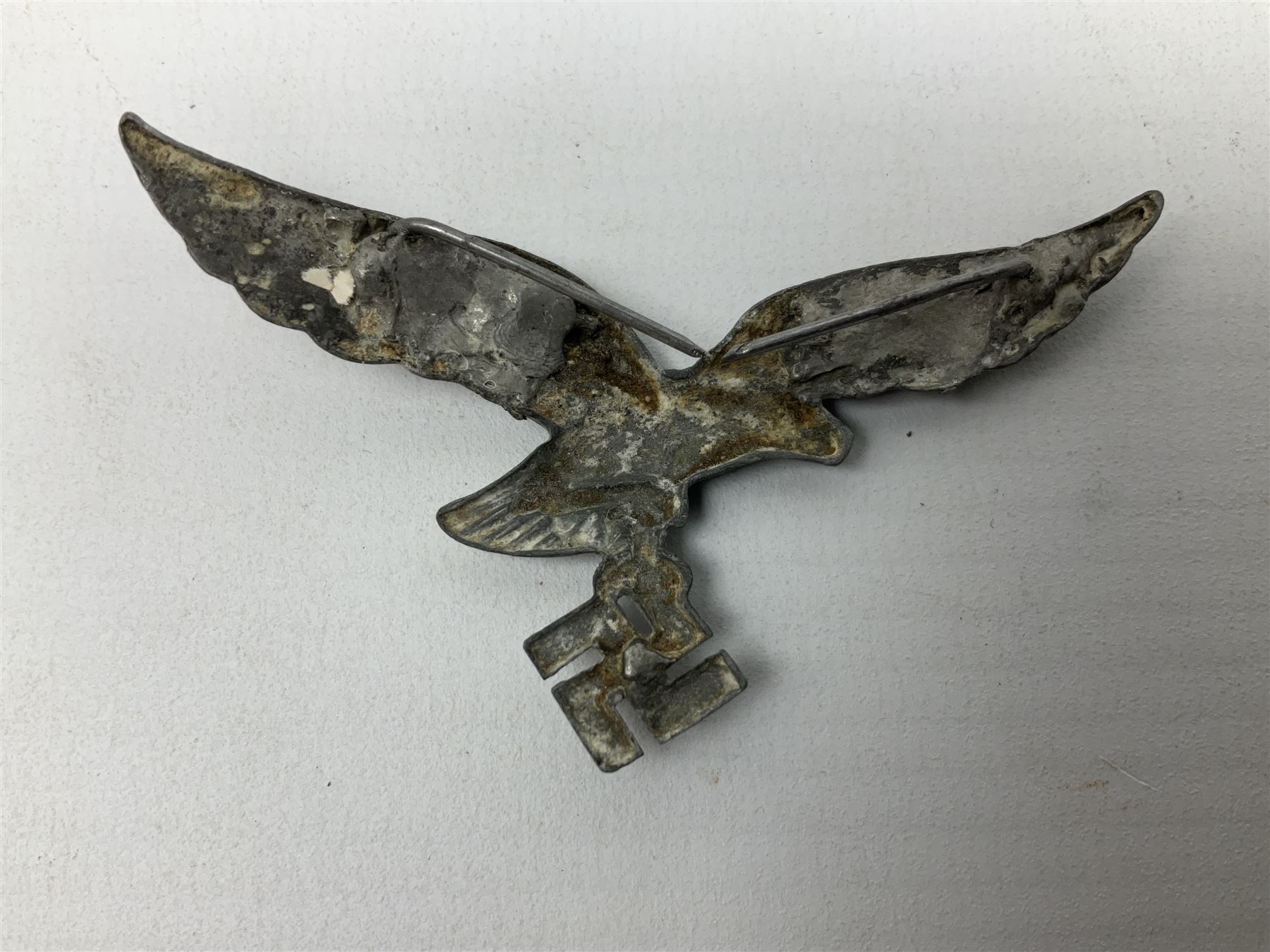 Five WW2 German peaked cap badges, four with double-pinned backs