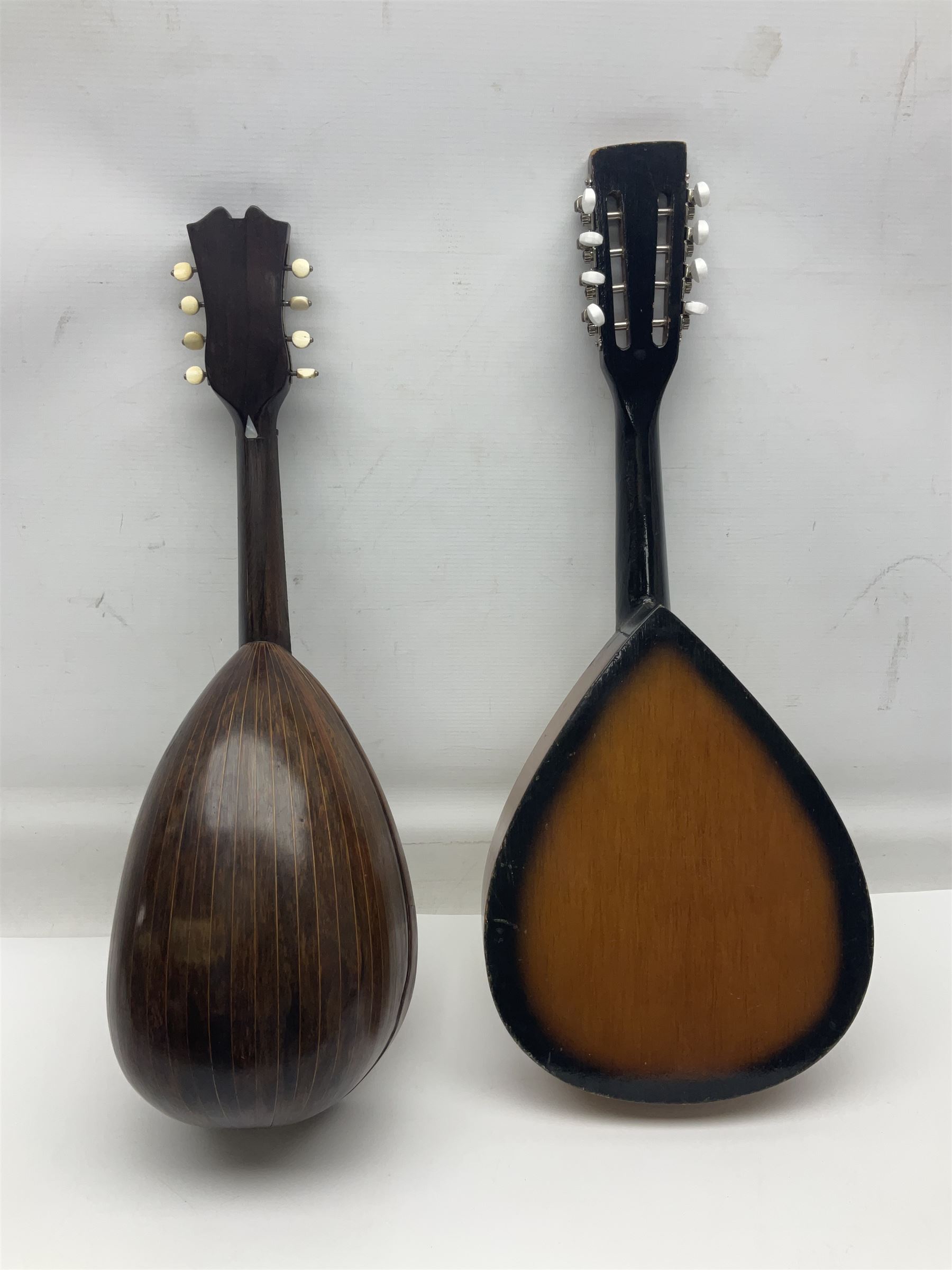 French mandolin with segmented lute back and mother-of-pearl inlaid spruce top; bears label for 'Jerome Thibouville-Lamy & Cie Paris L60cm; and another unmarked flat-back mandolin; both for completion (2)