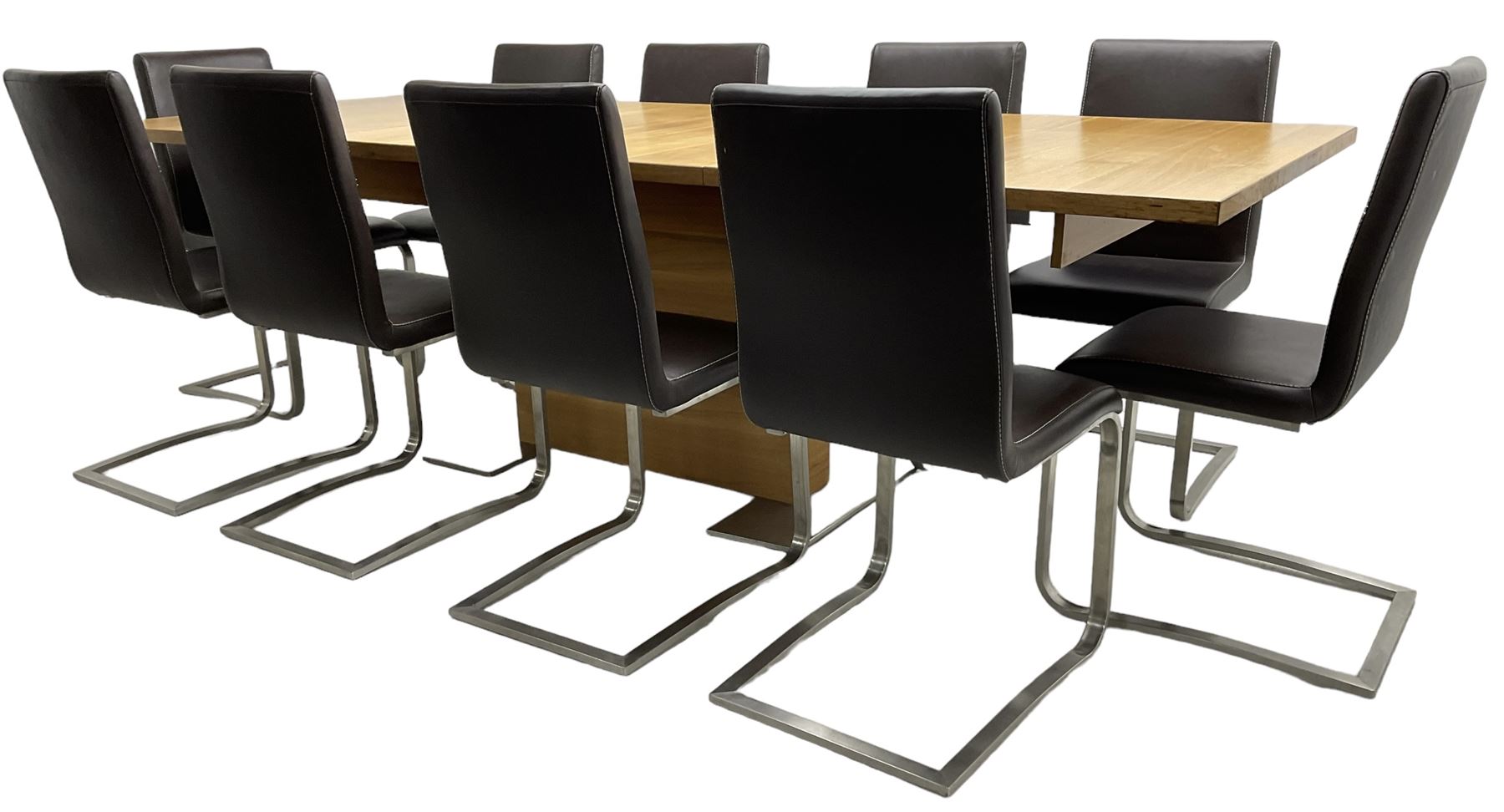 Contemporary walnut extending dining table, rectangular pull-out extending action top with two additional leaves, on rectangular base with burnished metal feet (160cm - 258cm x 100cm, H78cm); together with a set of ten cantilever dining chairs upholstered in stitched brown leather, on burnished metal supports 