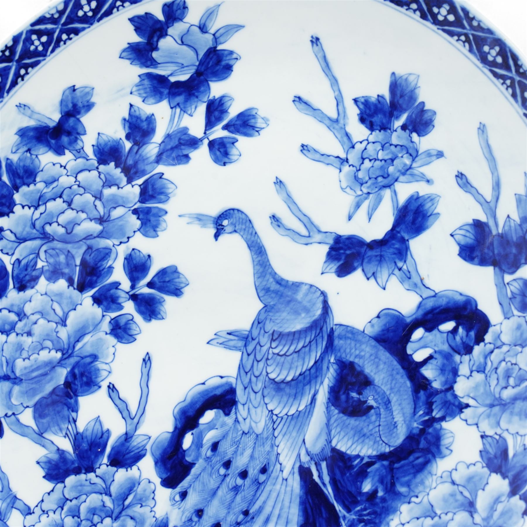 Japanese charger decorated in blue and white with peacock, flowers etc D46cm