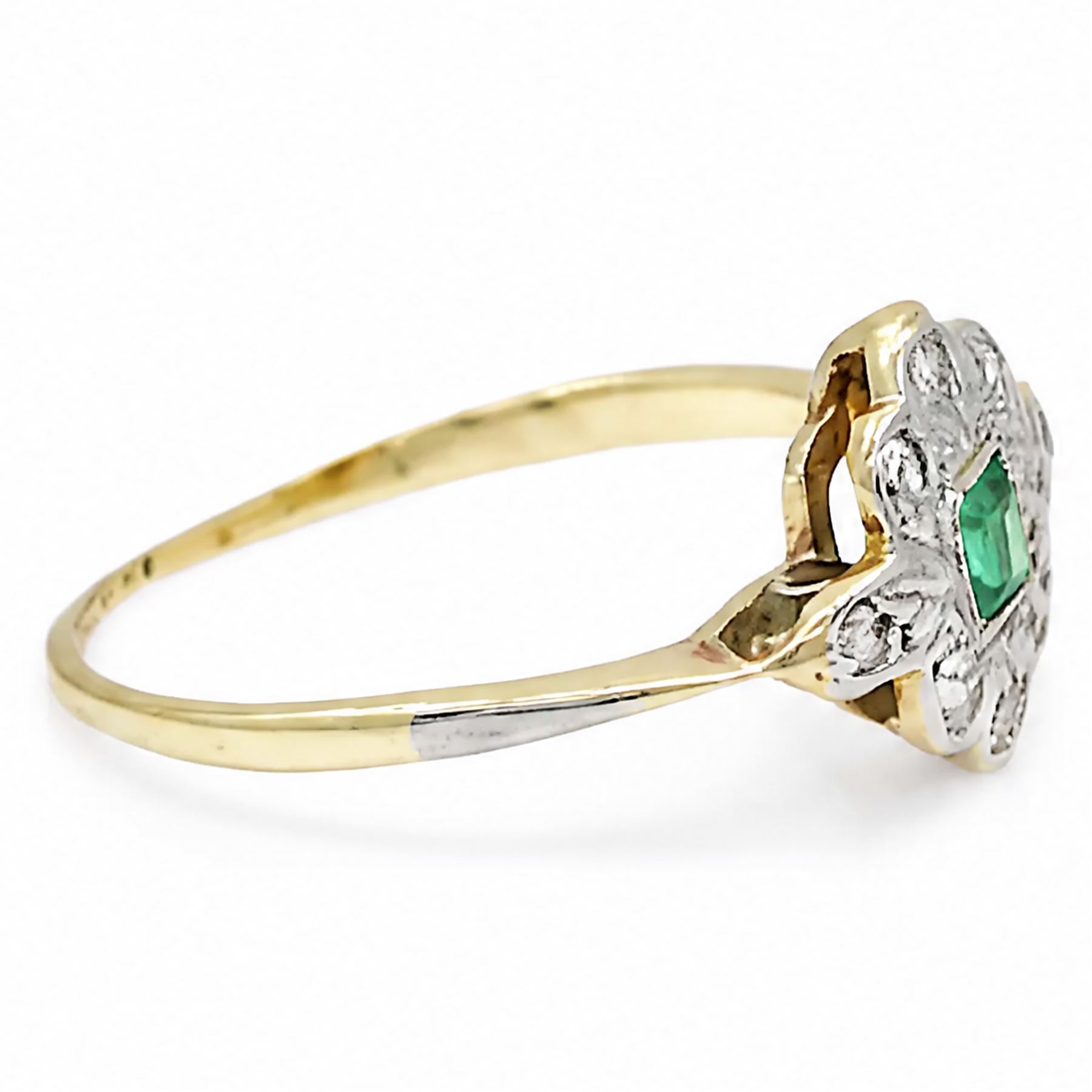 Early 20th century gold and platinum emerald and diamond panel ring, single rectangular cut emerald, surrounded by eight single cut diamonds, stamped 18ct & PT