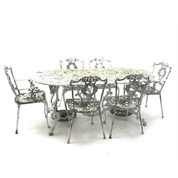  Ornate cast alloy garden table decorated with scrolls and foliage (186cm x 95cm, H72cm), and set six chairs  