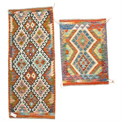 Two Chobi flatweave kilims, comprising a kilim with a repeating stepped diamond medallion ...