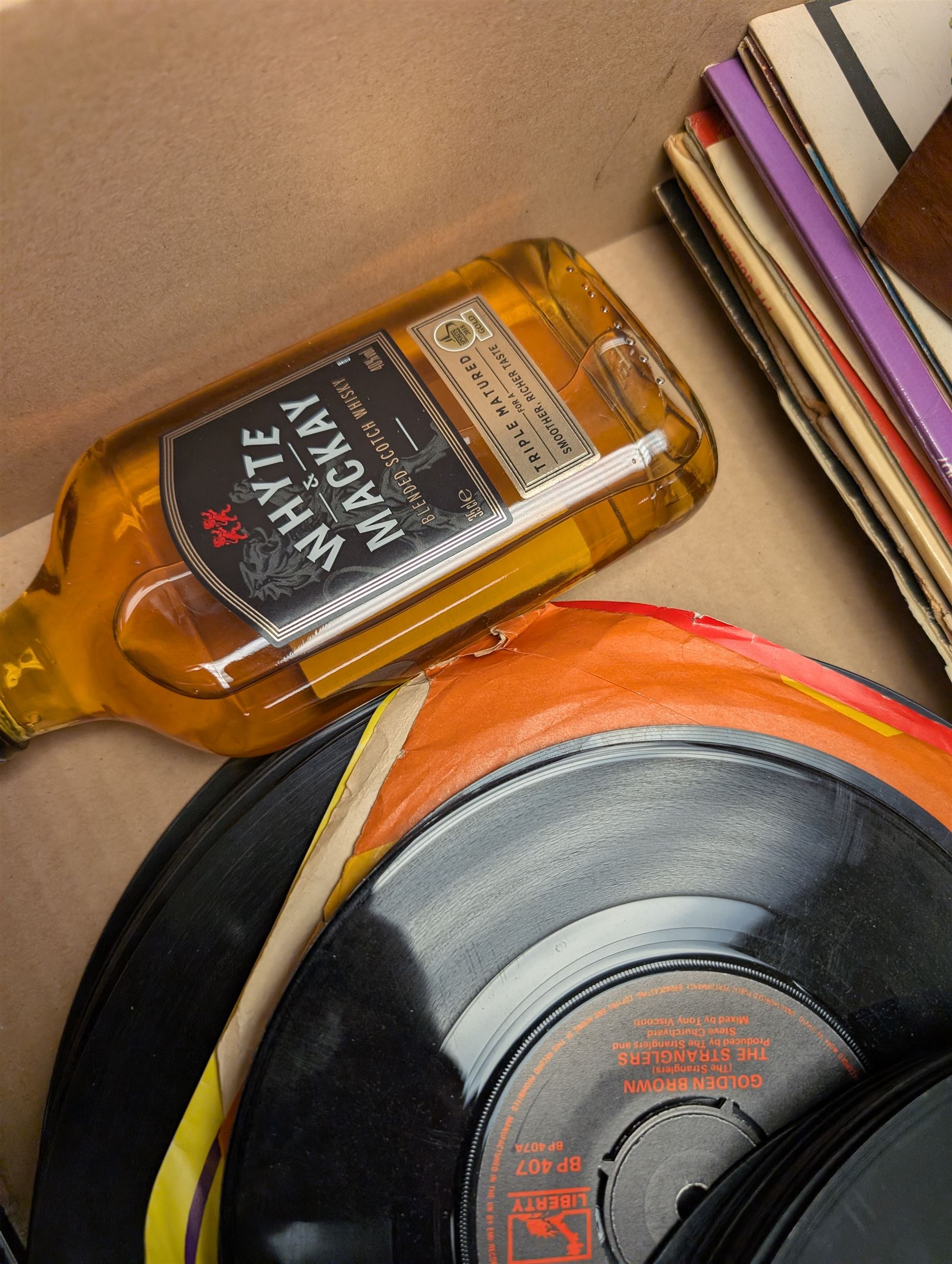 Giorgio Armani wristwatch, Whyte & Mackay blended scotch whisky, Bell's Blended scotch whisky, Chinese carved panels and a collection of vinyl records