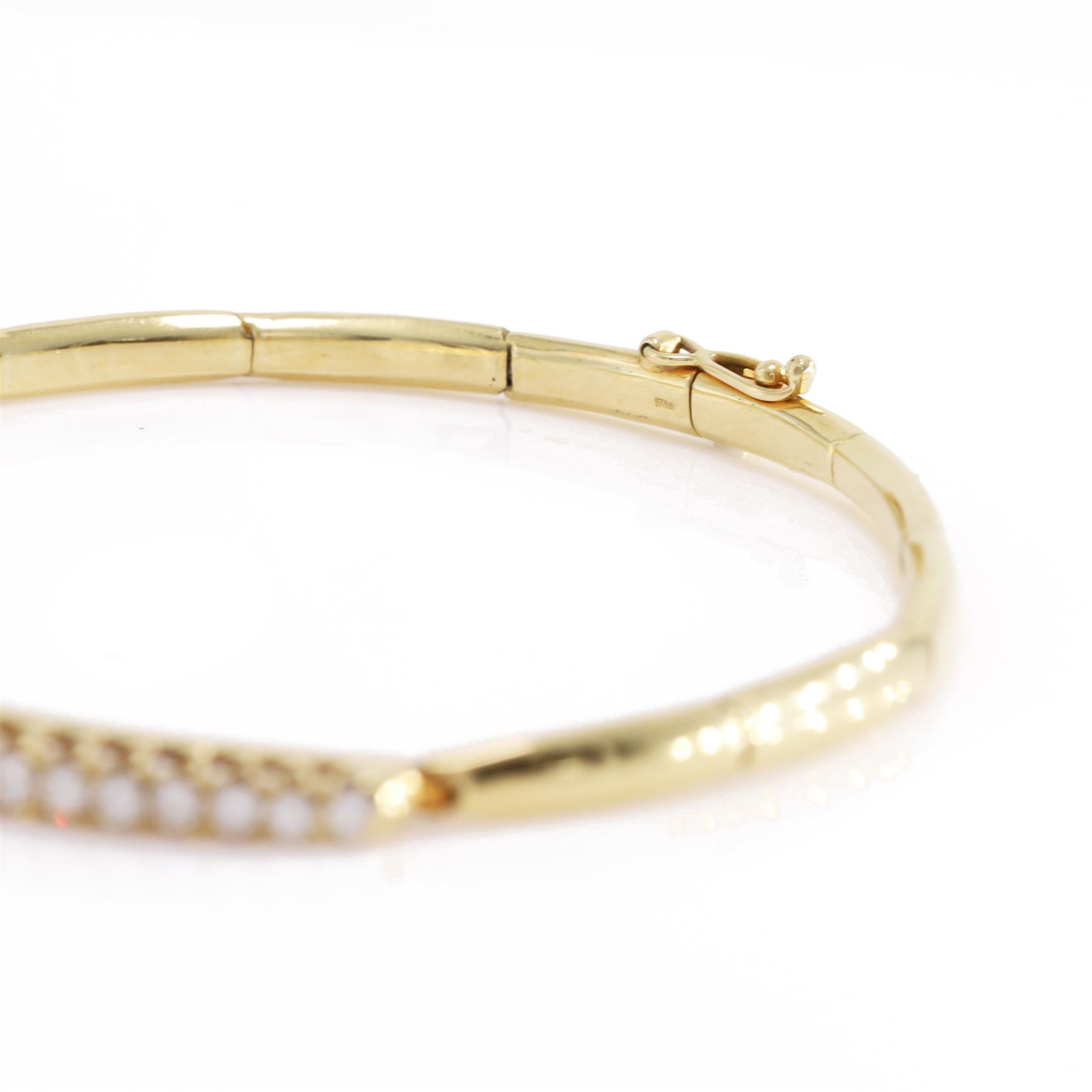 18ct gold diamond bracelet, set with twenty-one graduating round brilliant cut diamonds, to an articulated link bracelet, Birmingham import mark 1981, total diamond weight approx 1.25 carat