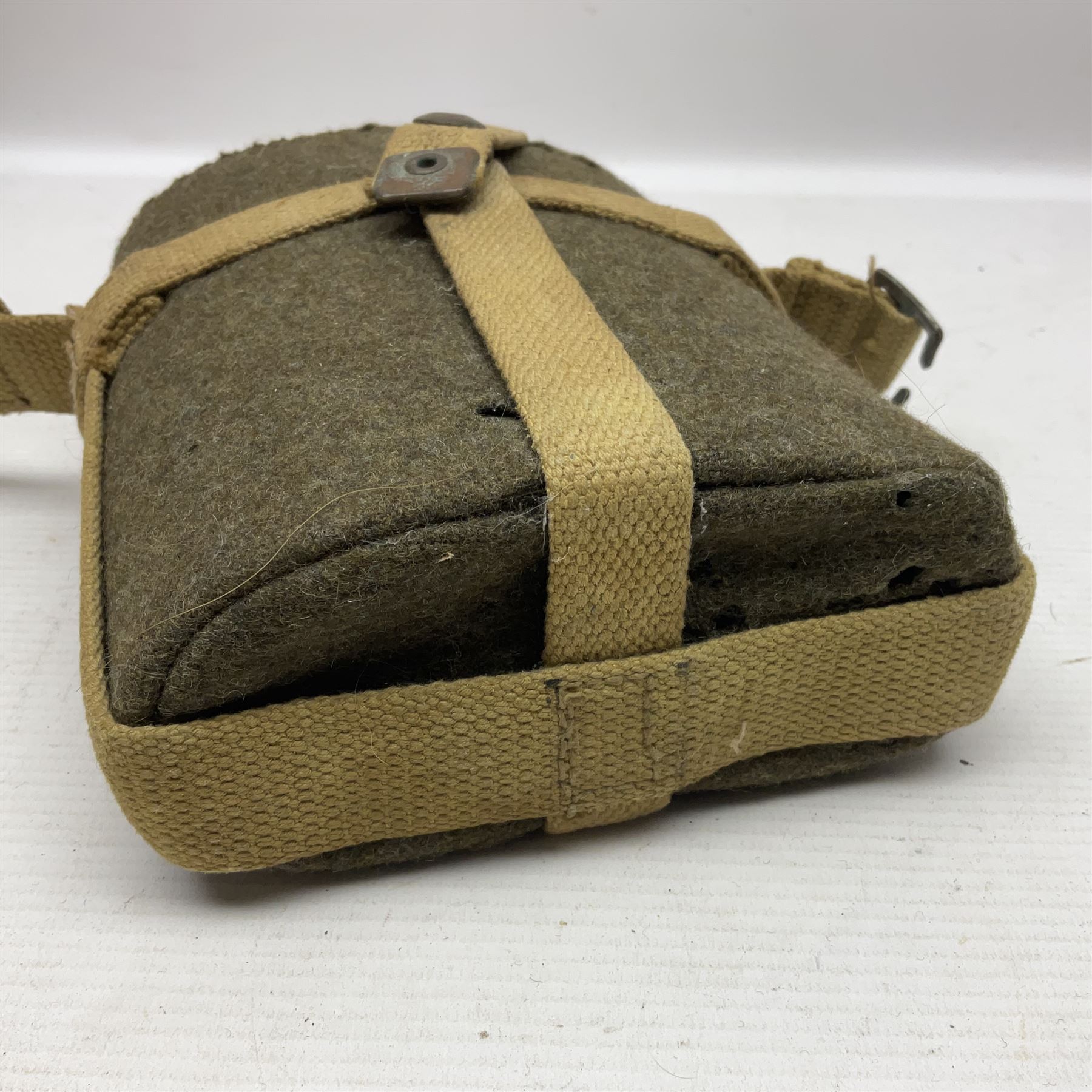 Five military caps/berets comprising two peaked caps with 'Yorkshire' and 'Royal Engineers' badges; maroon beret with parachute regiment badge; red beret with Military Police badge; and AB seaman hat with HM Submarines band; and a felt and webbing covered water bottle (6)