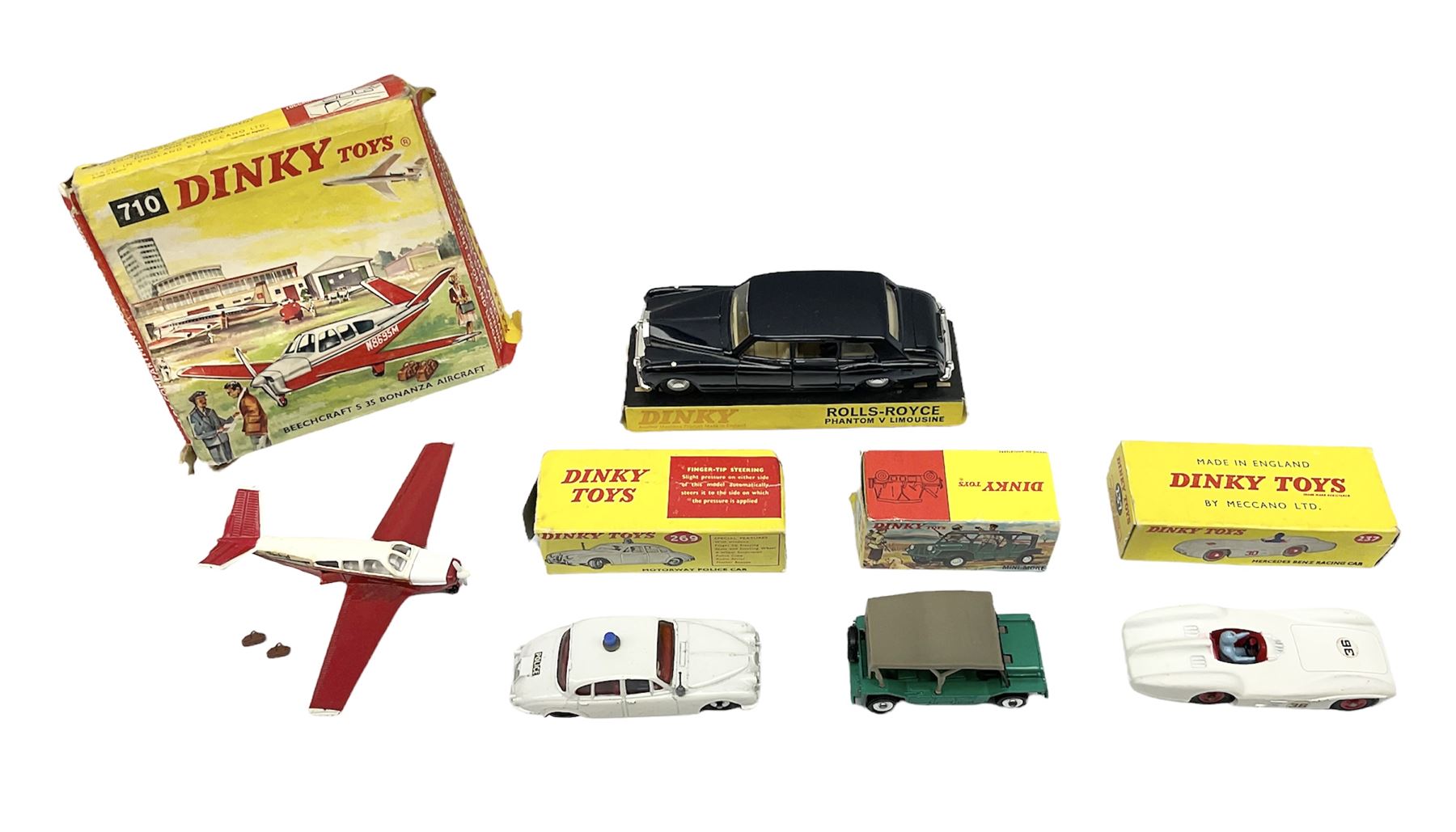 Dinky - Mercedes Benz Racing Car RN 36, No.237; Motorway Police Car No.269; Austin Mini-Moke No.342; Beechcraft S 35 Bonanza Aircraft with two pieces of luggage No.710; all boxed: and Rolls Royce Phantom V Limousine No.152; box base only with no cover (5)