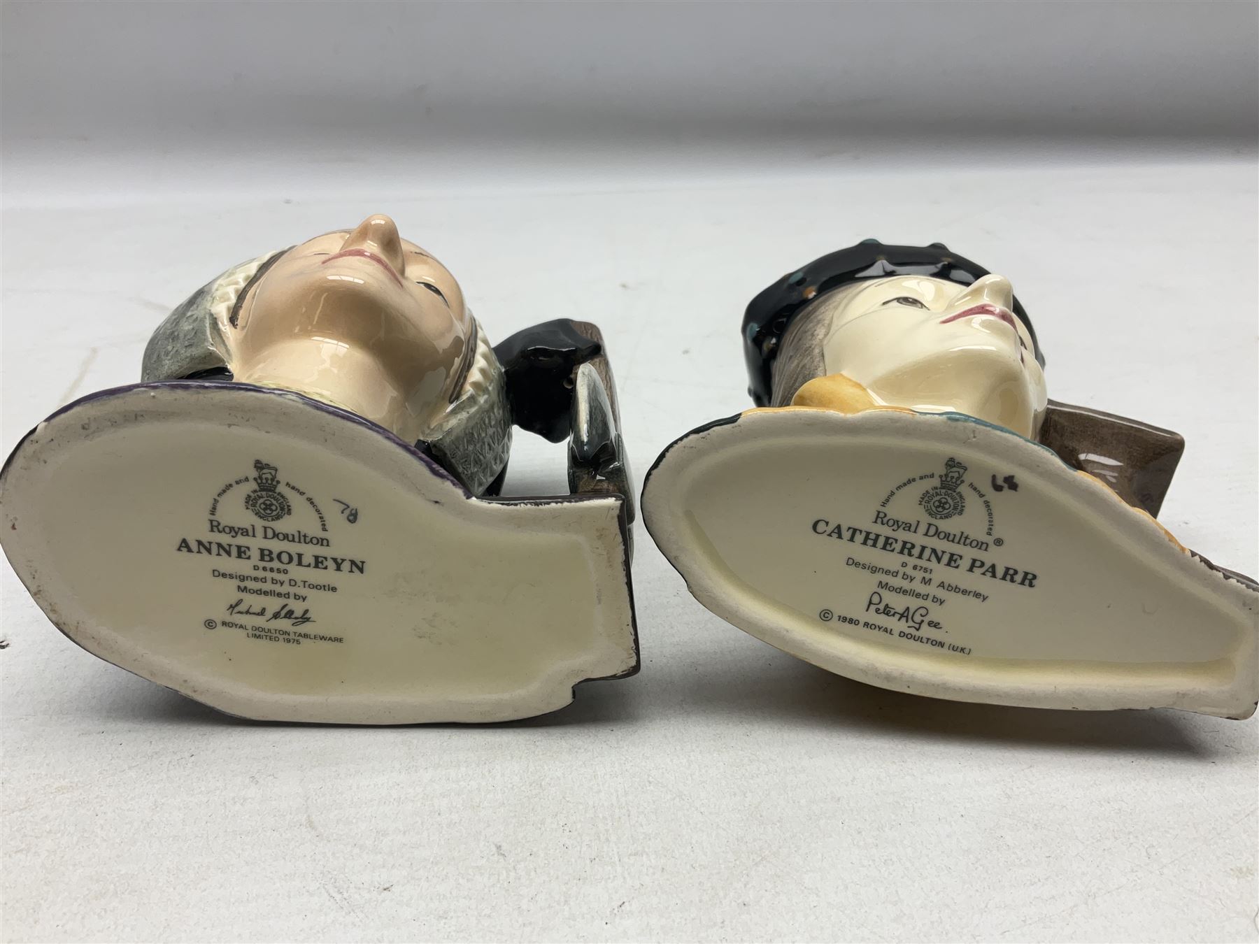 Royal Doulton Henry VIII and his Six Wives Character Jugs, comprising of Henry VIII D6647, Catherine of Aragon D6657, Anne Boleyn D6650, Jane Seymour D6746, Anne of Cleves D6753, Catherine Howard D6692 and Catherine Parr D6751, tallest H10cm