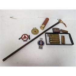 Walking stick with carved monkey handle, glass shooting flask in the form of a cartridge, bullet casings and other collectables