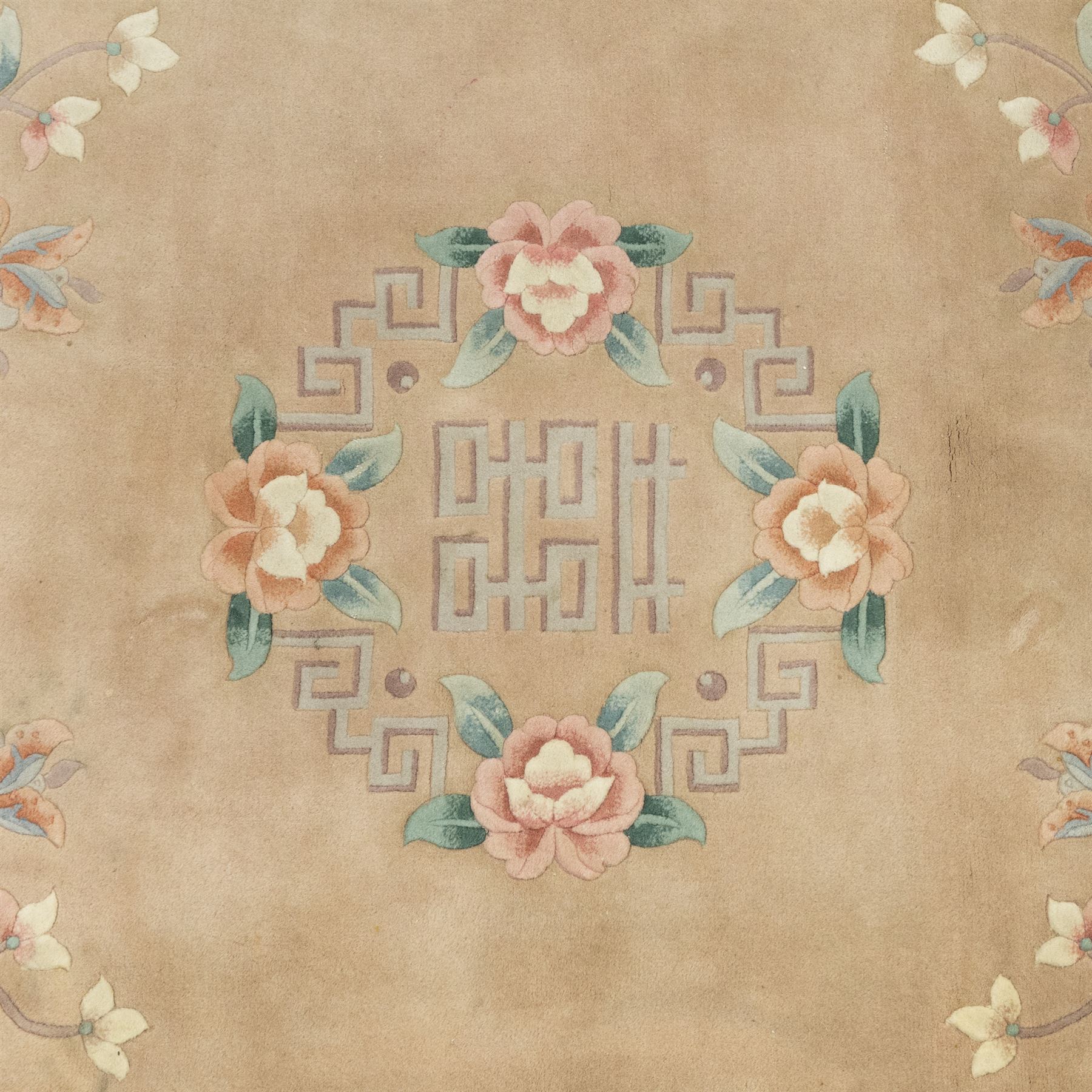 Chinese wool rug, beige ground decorated with peonies, flowering branches and butterflies, centred by a shou symbol within key pattern surround, cream border with floral sprays and double happiness motifs, cotton fringe ends