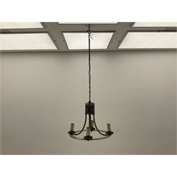 Gothic style iron chandelier with drip pans and twisted branches together with three matching twin wall sconces