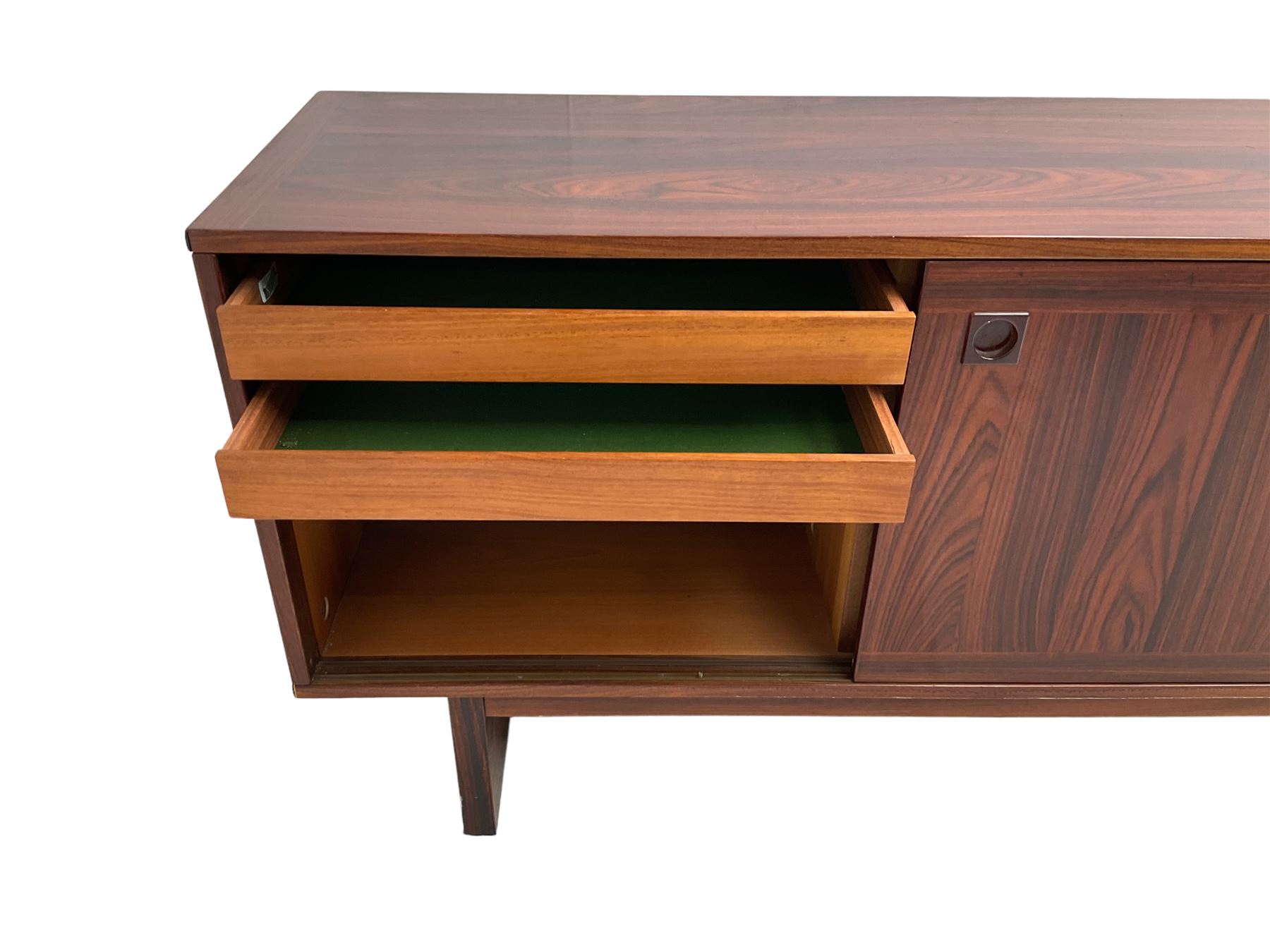NH Chapman & Co Siesta - mid-20th century sideboard, fitted with three sliding doors, enclosing two drawers and shelves, raised on twin end supports