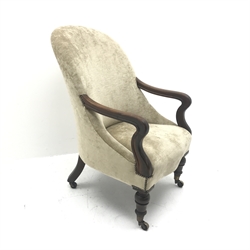 Victorian mahogany framed salon armchair, turned supports on castors, W59cm 
