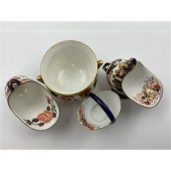 Group of Crown Derby and Royal Crown Derby Imari pattern miniatures, including mid 19th century Stevenson and Hancock cauldron, with painted mark beneath, H5.5cm, a near pair of early Royal Crown Derby scuttles, decorated in the 6299 pattern, each with printed and painted marks beneath including illustration date codes for 1913 and 1922, tallest 6.5cm, and a further early 20th century Royal Crown Derby scuttle, decorated in the 6299 pattern, with printed and painted marks beneath including illustration date code for 1922, H5.5cm, (4)
