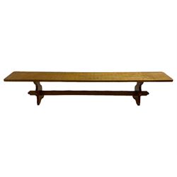 Gnomeman - adzed oak narrow bench, rectangular seat on shaped end supports united by pegged stretcher, carved with gnome signature, by Thomas Whittaker, Little Beck 