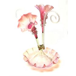 A Victorian cranberry and Vaseline glass epergne, the frilled bowl supporting two frilled trumpets and two canes, H41cm. 