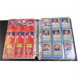 Collection of Football related trading cards, stickers and coins, including 1990 Esso World Cup Coin Collection, an empty 2010 Esso Official England Medal Collection Folder, incomplete 1990 Italy World Cup Commemorative Medal Collection, 1998 The Official England Squad Medal Collection, 1970s Topps All Stars Cards, 1992 Panini Official Football Players cards, Euro 2008 Collectors Binder and Cards, Panini 2009/10 Champions League Stickers, etc housed in four folders