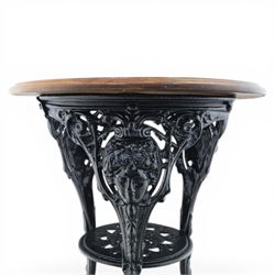 20th century stained hardwood pub table, round boarded top with moulded rim, supported on an ornate pierced cast iron pedestal with scrolling detail and three cabriole supports ending in pad feet