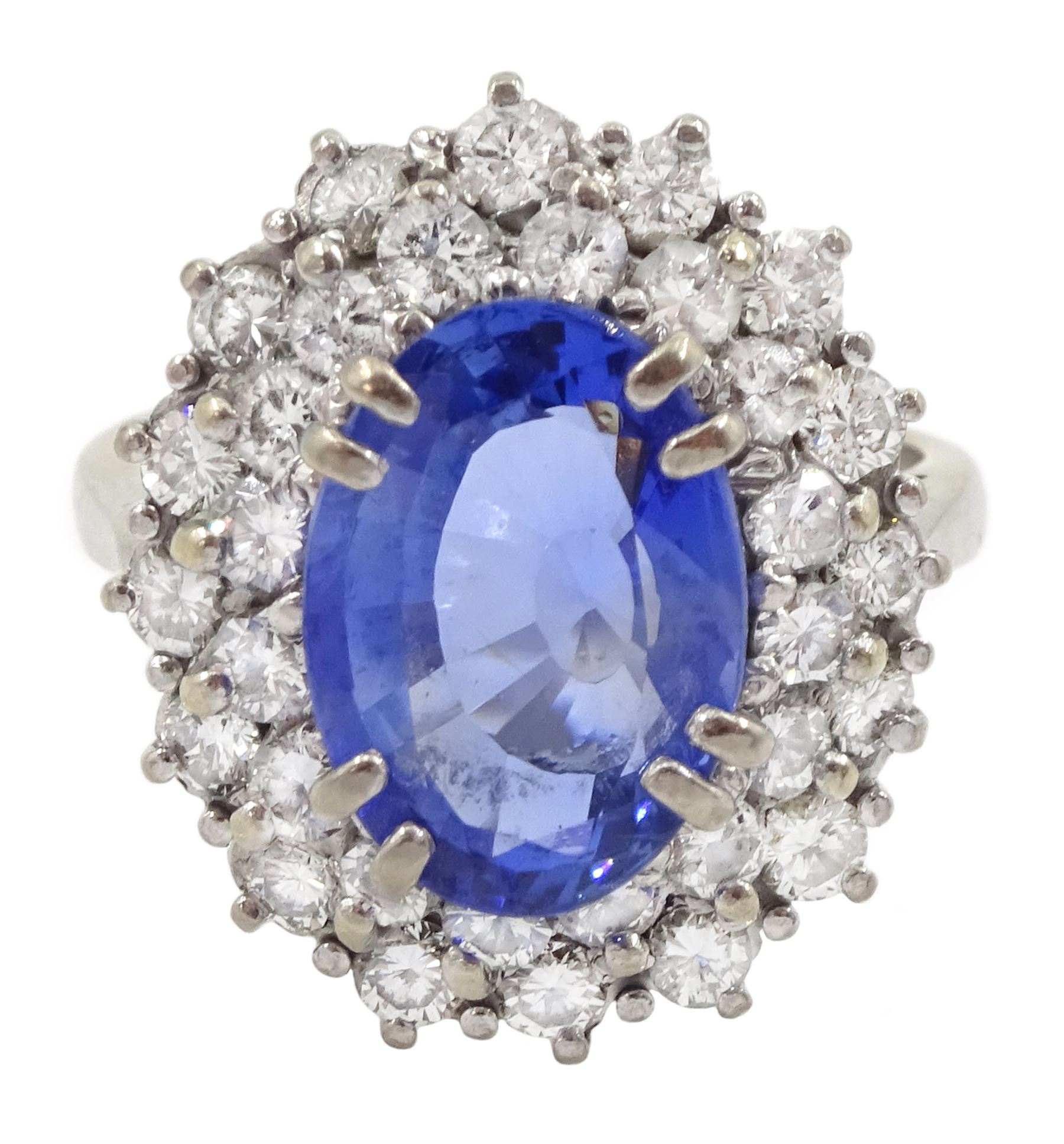 18ct white gold oval sapphire and round brilliant cut diamond cluster ring, Sheffield 2000, sapphire approx 3.75 carat, total diamond weight approx 0.70 carat