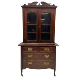 Late Victorian cabinet on chest, shaped and carved pediment over two glazed doors, the chest fitted with two short and two long drawers