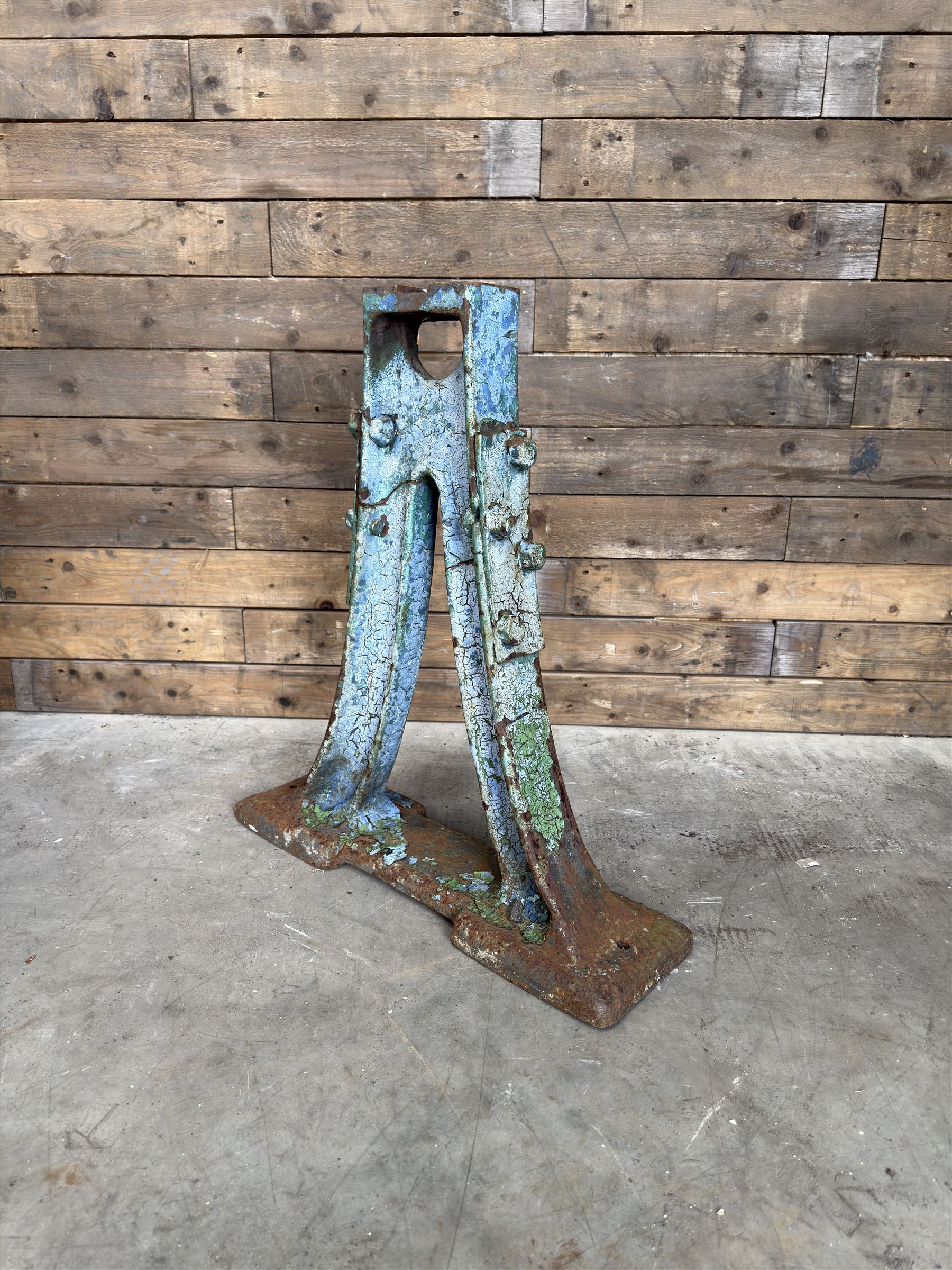 Pair of late 19th century heavy cast iron garden industrial trestles, painted in distressed blue paint