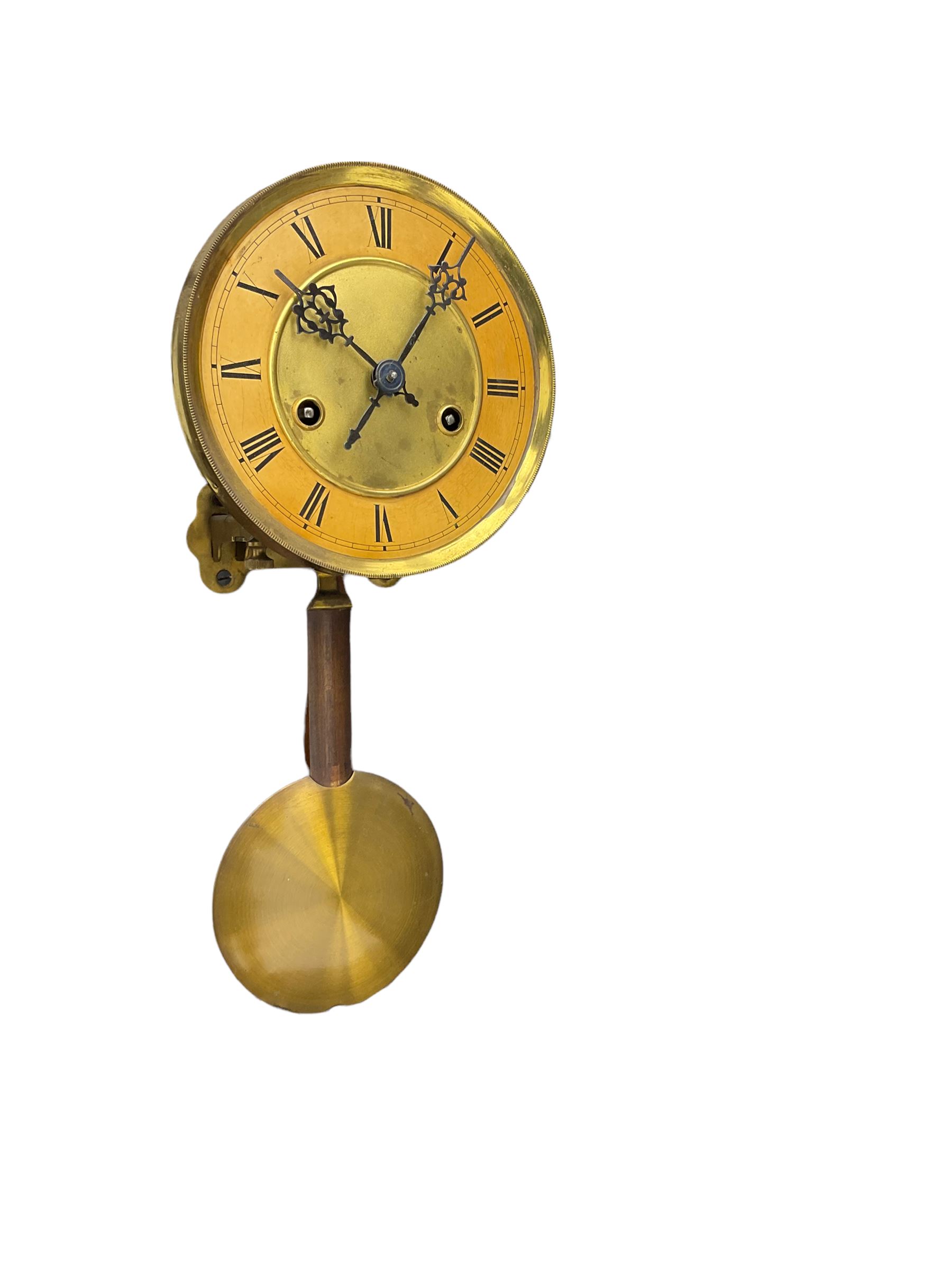 A late 19th century German wall clock c1880 with an 8-day HAC spring driven movement striking the hours on a coiled gong, in a mahogany case with a tall pediment and deeply turned columns flanking a full-length glazed door, with a two-part dial with a gilt centre and ivorine chapter, with Roman numerals, minute track and pierced gothic designed hands, spun brass faced pendulum and beat plate. With Key.



