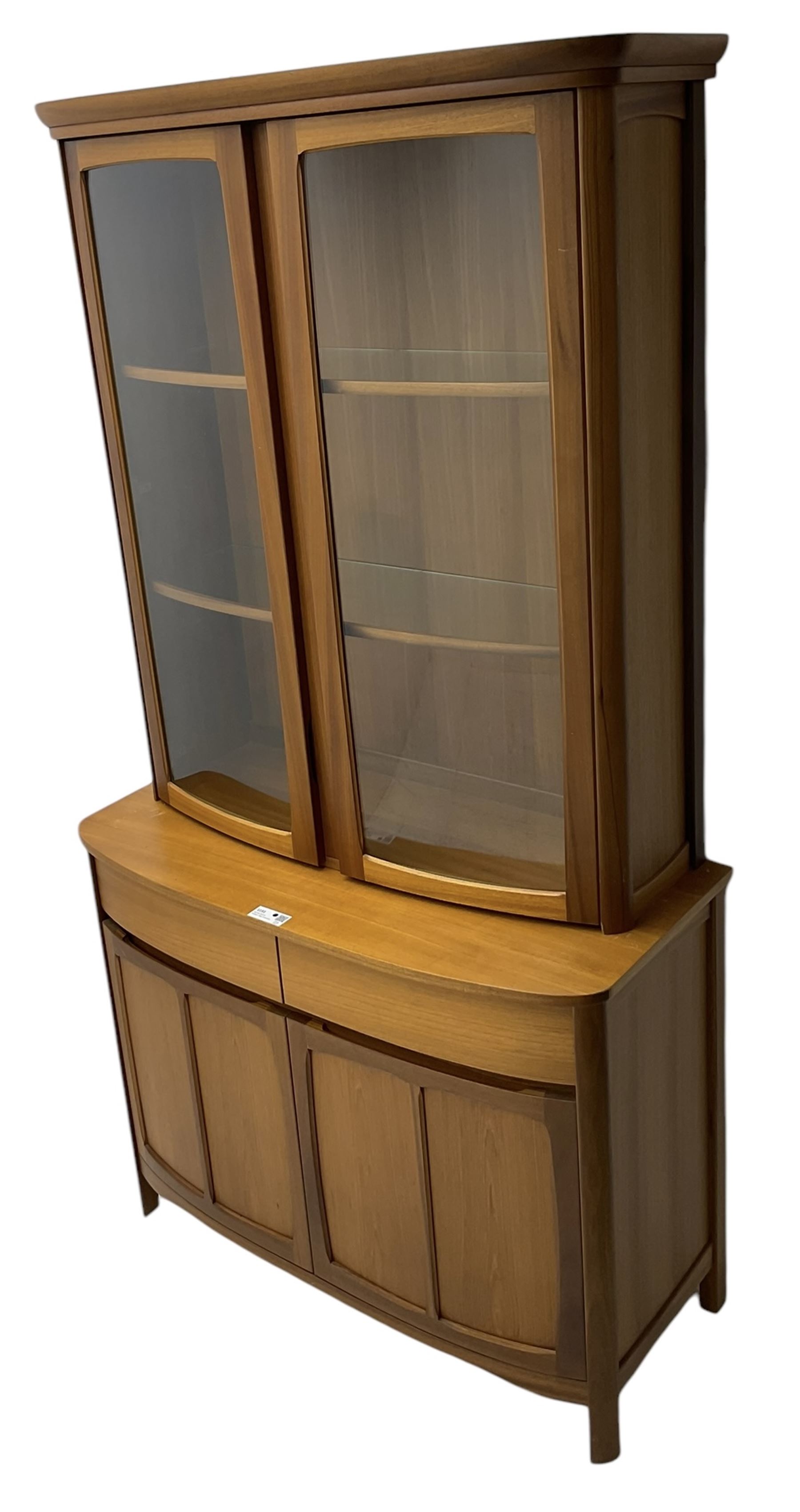 Nathan - teak wall display unit, raised display cabinet enclosed by two glazed doors, the lower section fitted with two drawers and double panelled cupboard 