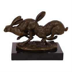 Bronze figure group, modelled two hares in chase, upon naturalistically modelled oval base...