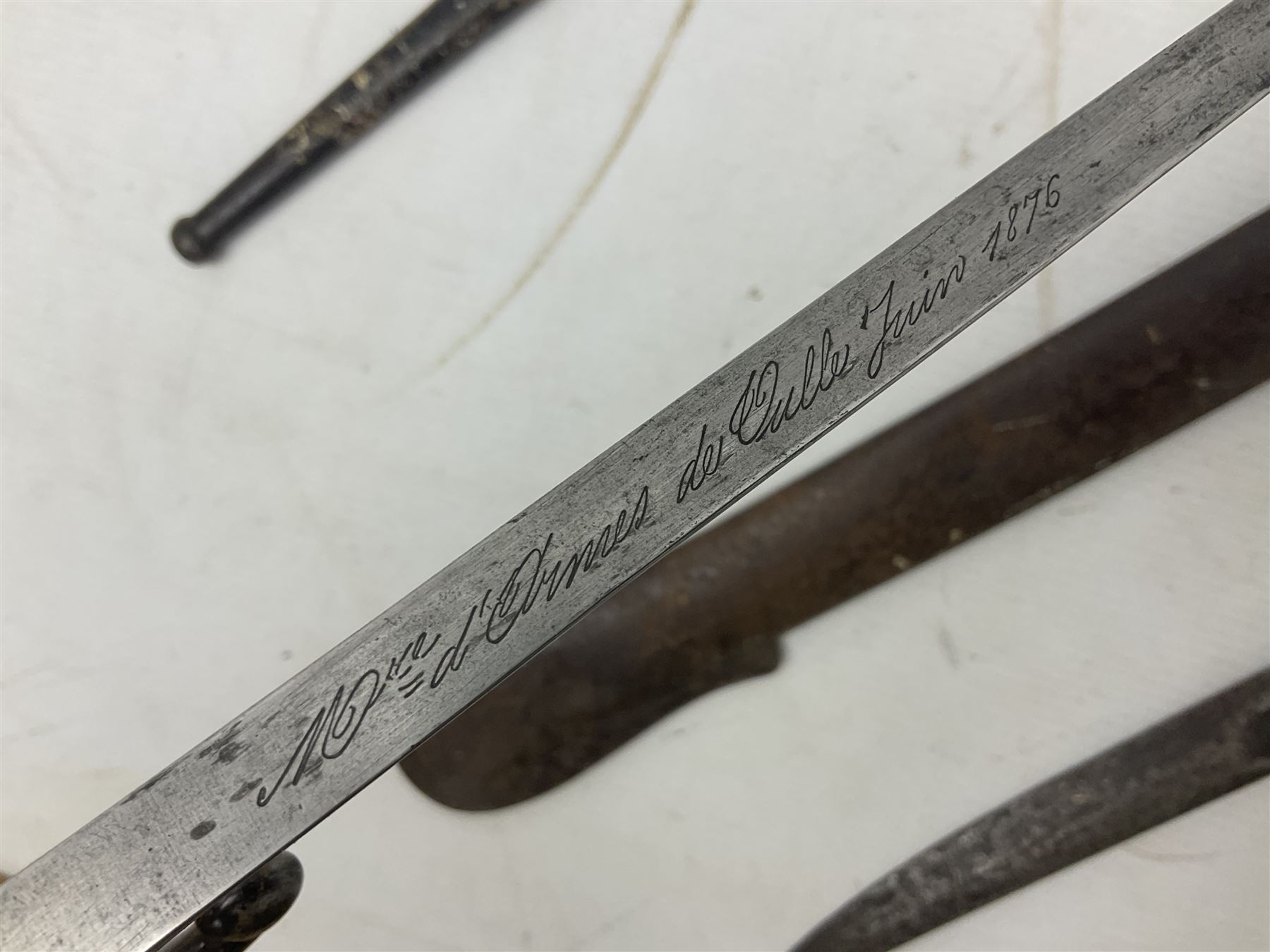 French Model 1874 Epee bayonet marked Oulle 1876 in associated scabbard; Model 1866 sabre bayonet in cut-down sword scabbard; and Model 1842/59 sabre bayonet in relic condition (3)
