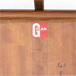 G Plan - Mid 20th century teak extending dining table and four chairs, oval top with stowed fold-over leaf extending to 208cm, raised on two shaped supports united by a stretcher 