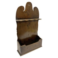 George III oak spoon rack, the shaped back with five aperture spoon rack, above a lower open candle compartment, H55cm L31cm D10cm