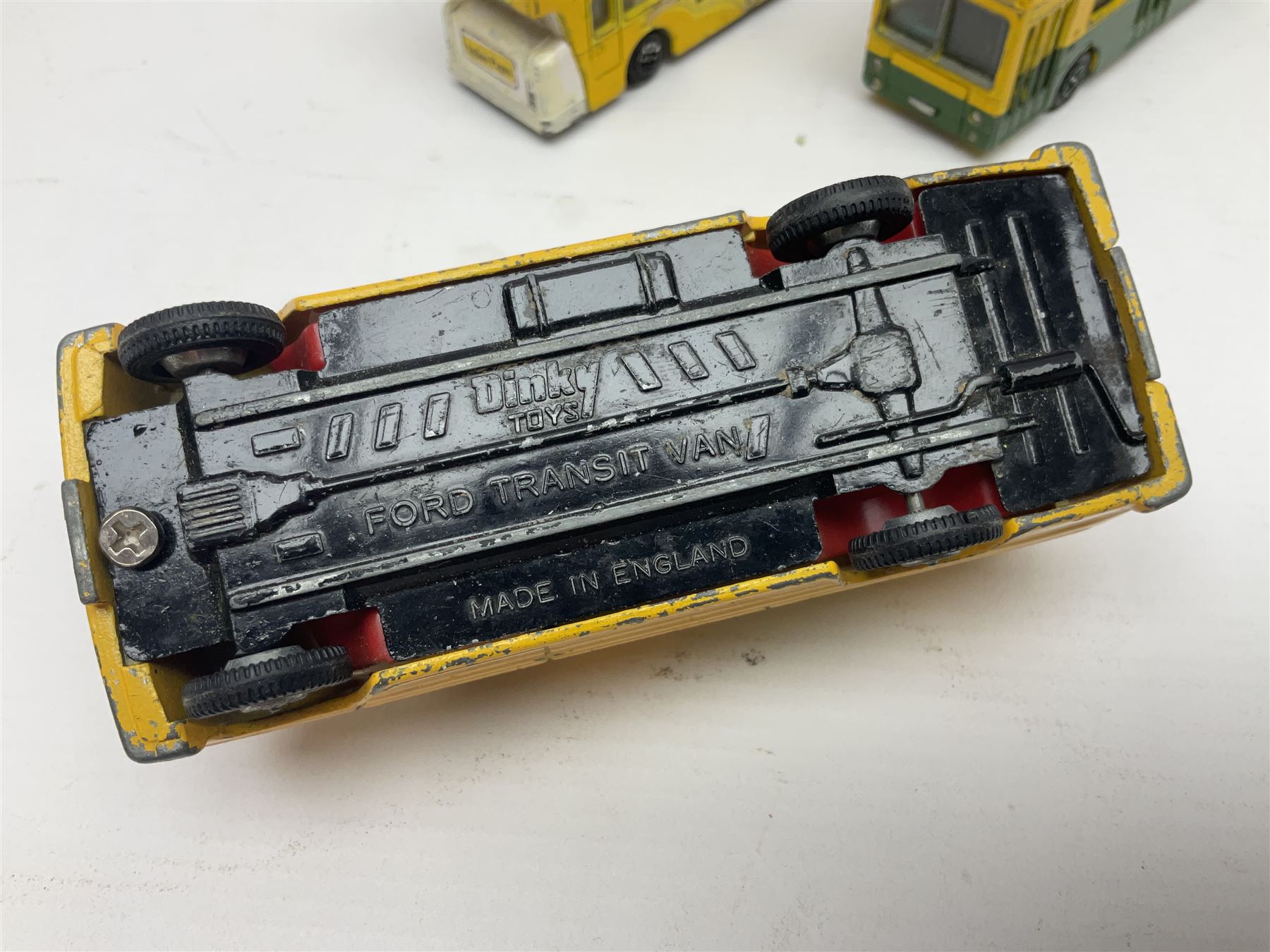 Dinky - sixteen unboxed and playworn die-cast models to include Single Deck Bus, two Atlantean Buses, Ford Transit Van, 10 Ton Army Truck, MGB Sports Car, Telephone Service Van etc 