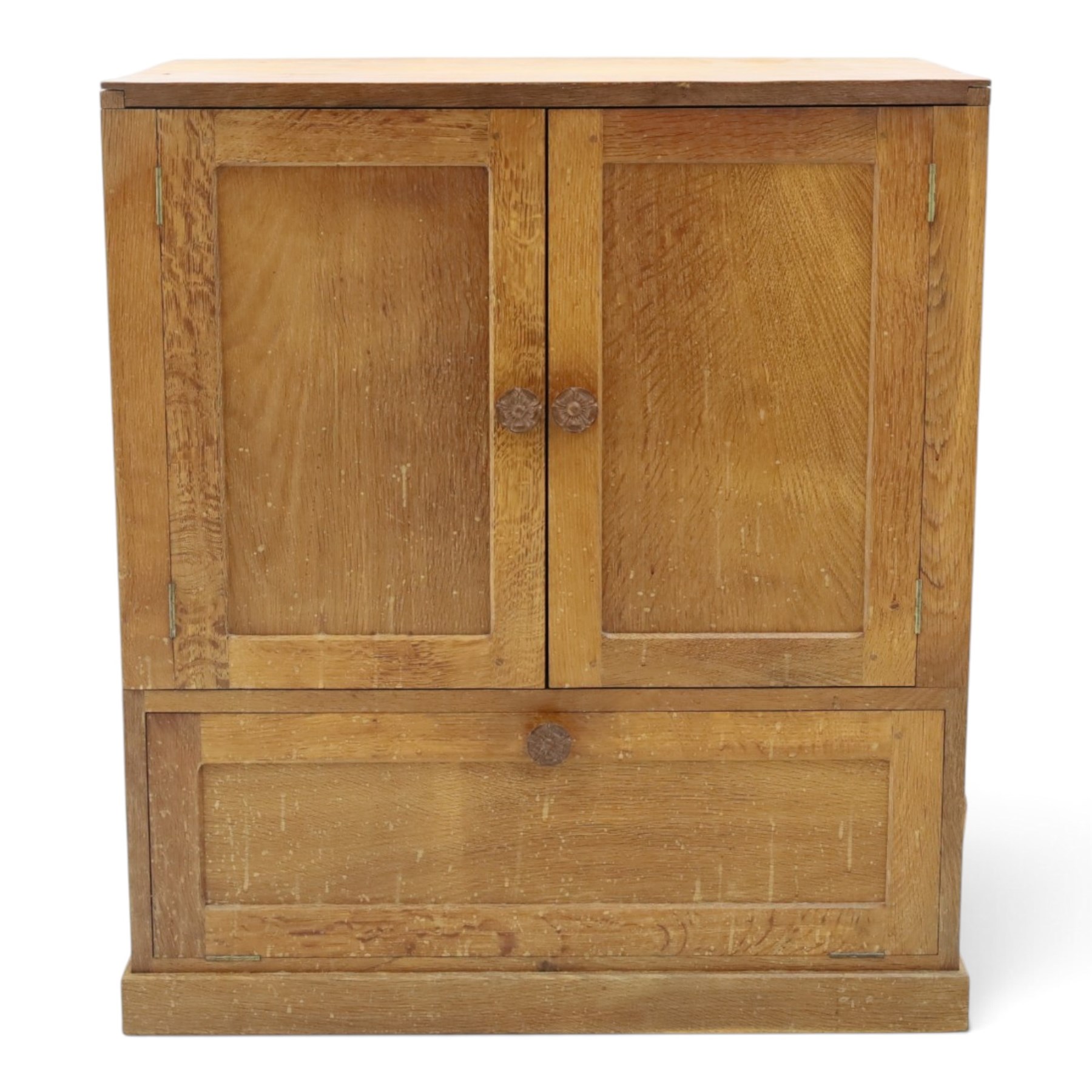 Lizardman - adzed oak media cabinet, adzed rectangular top above twin doors enclosing a shelved interior, above a fall front drawer, Yorkshire Rose carved handles, raised on castors, with carved lizard signature, by Derek Slater of Crayke  
