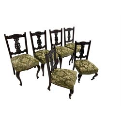 Set six (4+2) late 19th century mahogany dining chairs, pierced and carved splat back with cartouche and foliate design, scrolled cresting rail, sprung seat upholstered in green patterned fabric, raised on cabriole supports, the two shorter chairs with brass and ceramic castors
