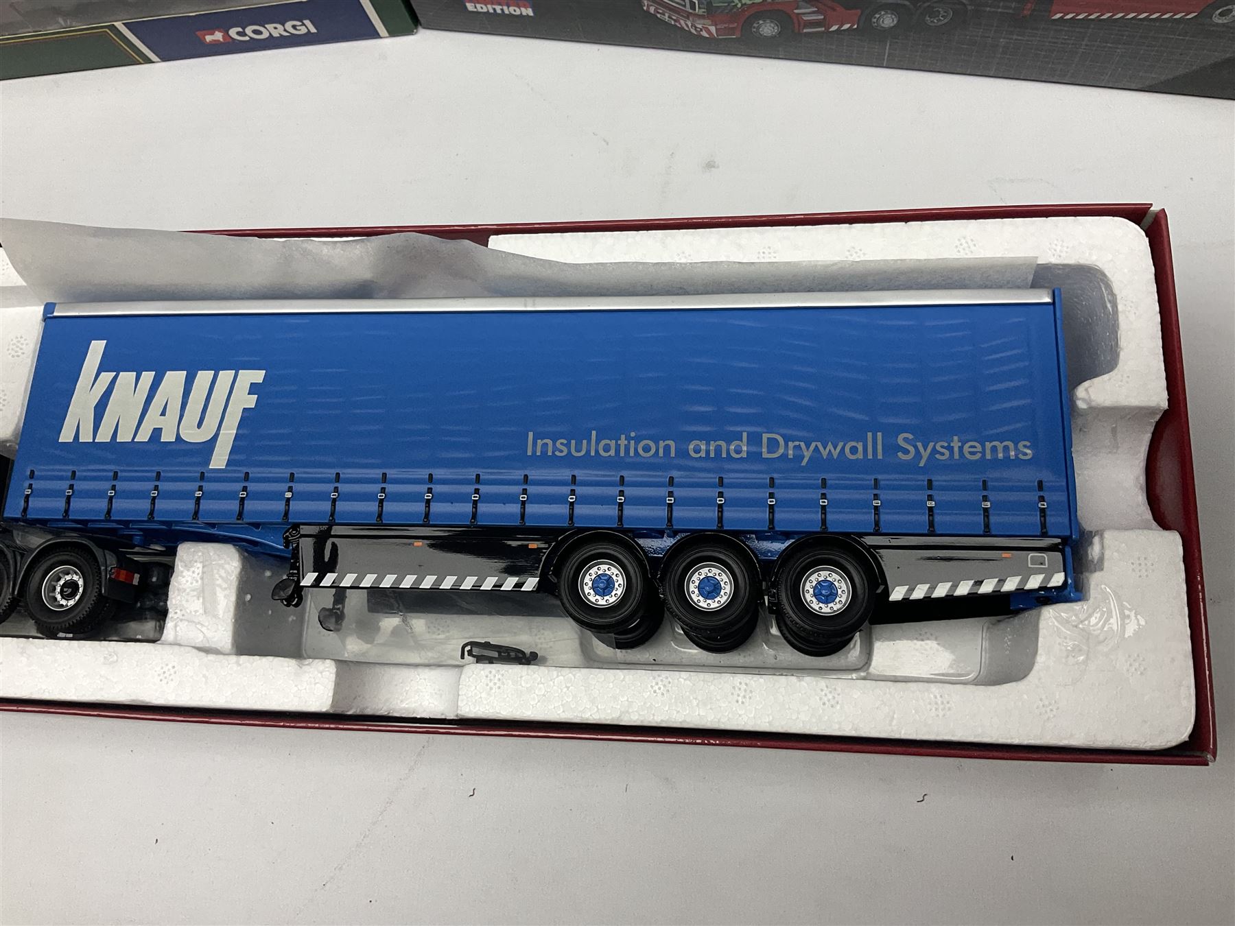Corgi Eddie Stobart - three limited edition lorries; CC12936 Sight & Sounds Scania Topline Curtainside Trailer; CC13812 Hauliers of Renown Mercedes-Benz Actros Curtainside Knauf; and CC13405 MAN TGA XL Step Frame Curtainside Trailer; all boxed (3)