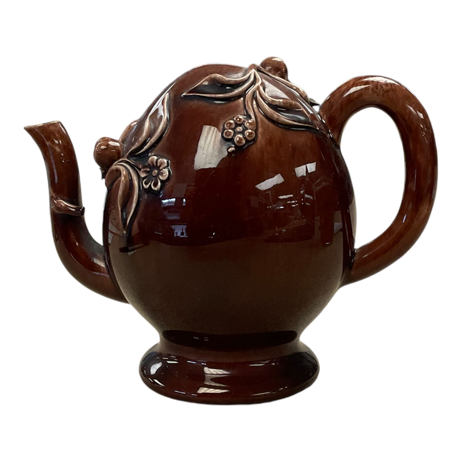 Brameld Cadogan Pottery Teapot, decorated in a brown glaze and applied with trailing fruit and flowers, impressed mark beneath 