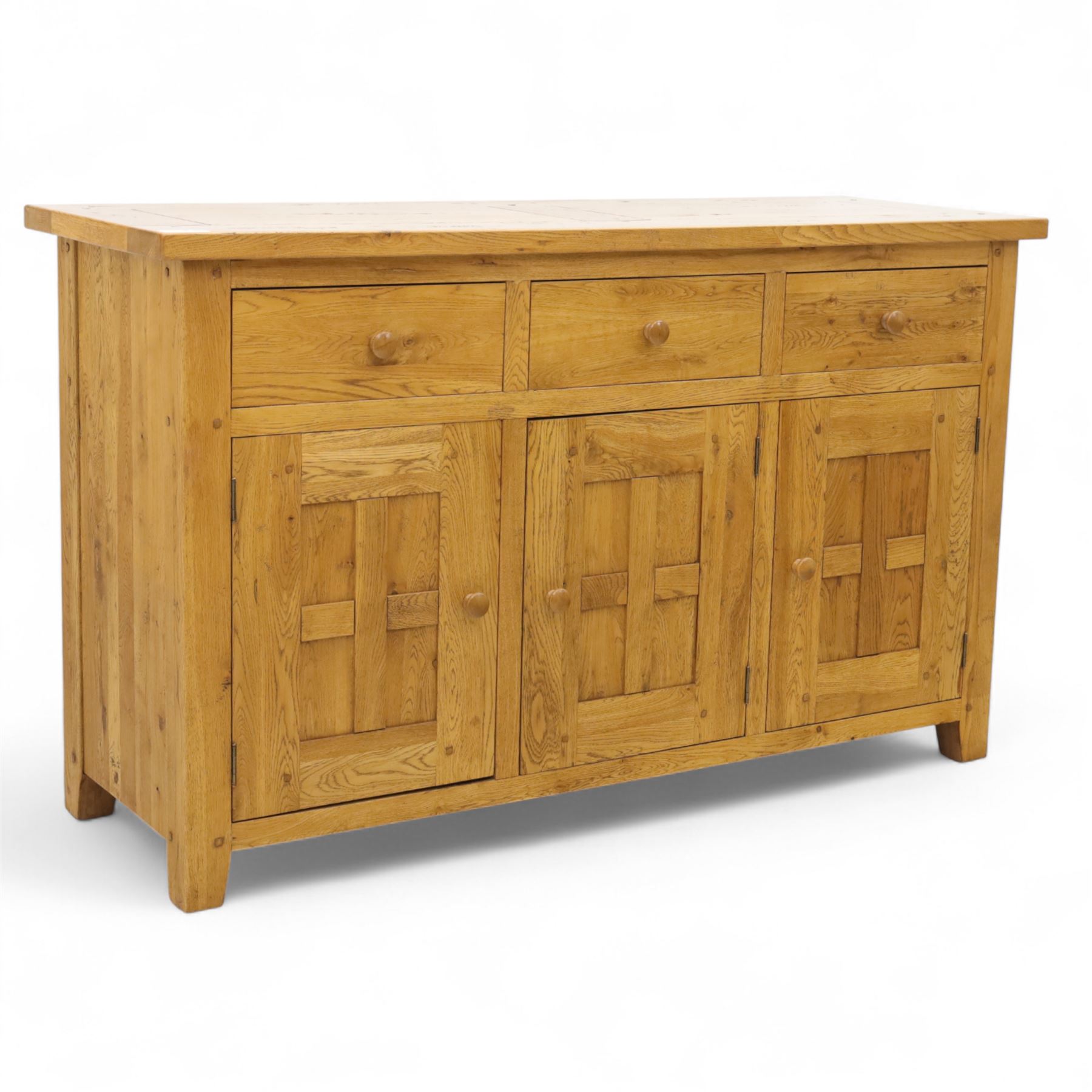Contemporary solid oak sideboard, rectangular plank top above three drawers and three panelled cupboard doors, fitted with wooden knop handles