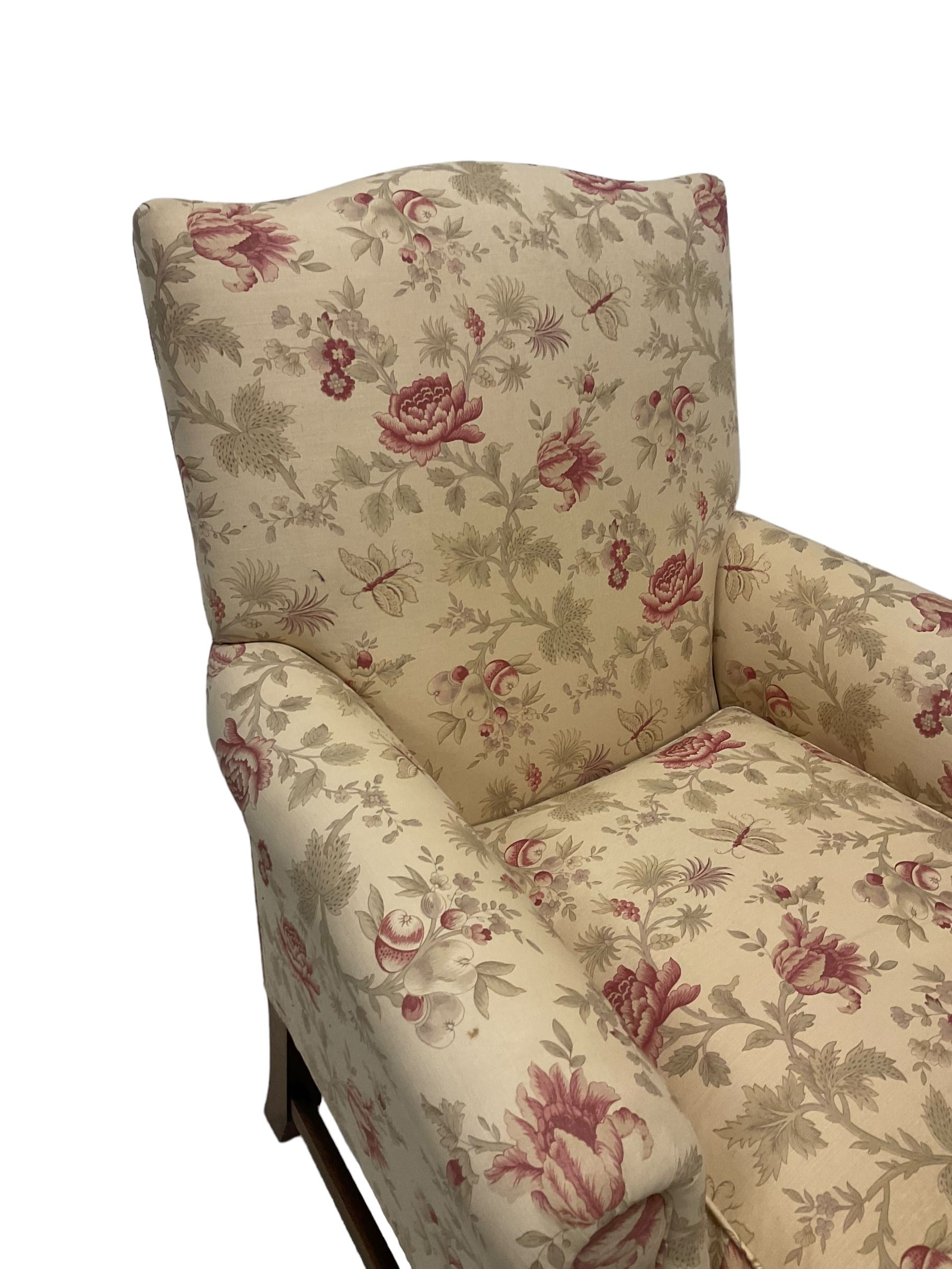 Peter Dudgeon - Georgian design mahogany framed armchair, shaped cresting rail over sprung back and seat flanked by rolled arms, upholstered in floral patterned fabric with matching seat cushion, on square supports joined by stretchers
Provenance: From the Estate of the late Dowager Lady St Oswald